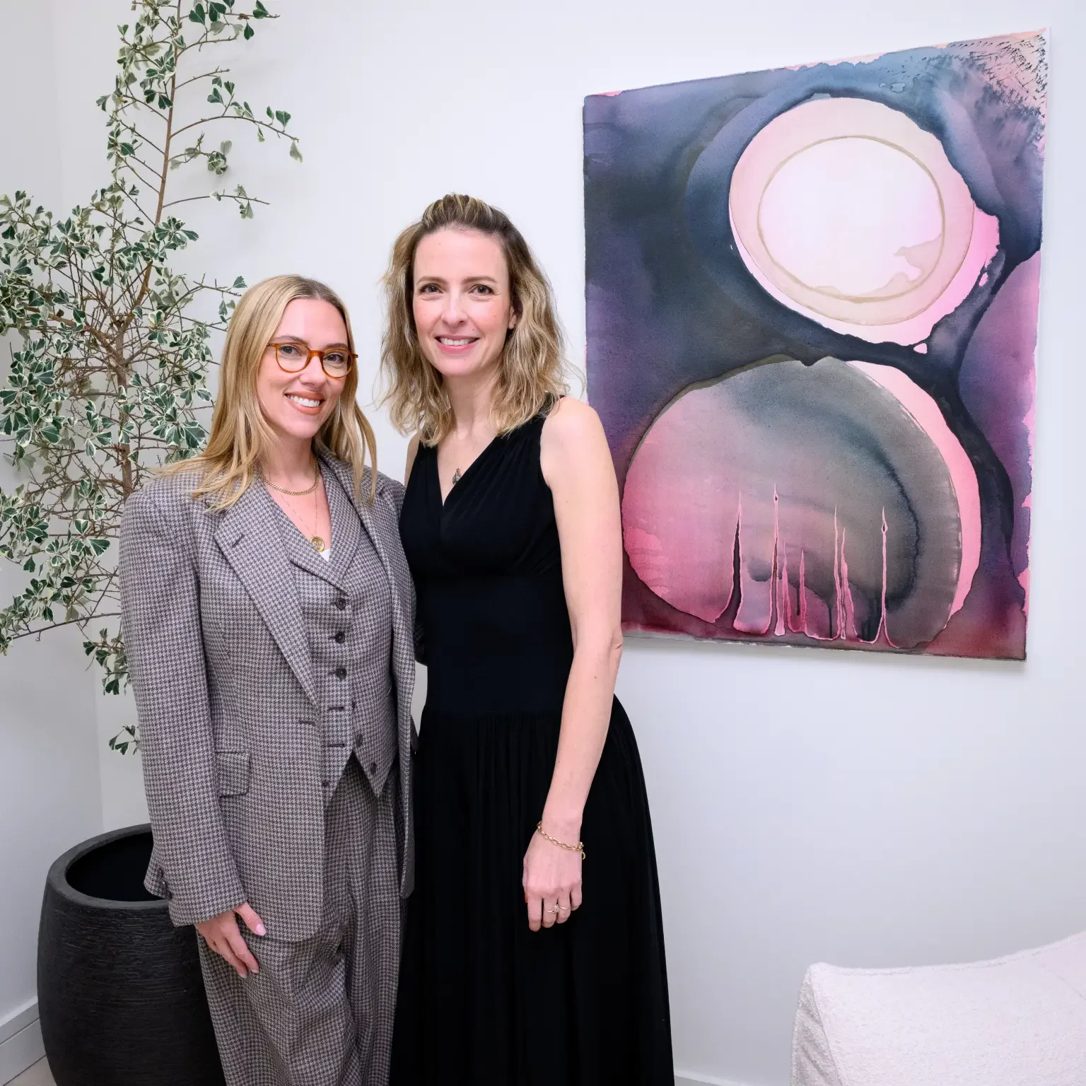 scarlett johansson attends her sister Vanessa's art opening in a lavish NYC penthouse standing in front of artwork painting