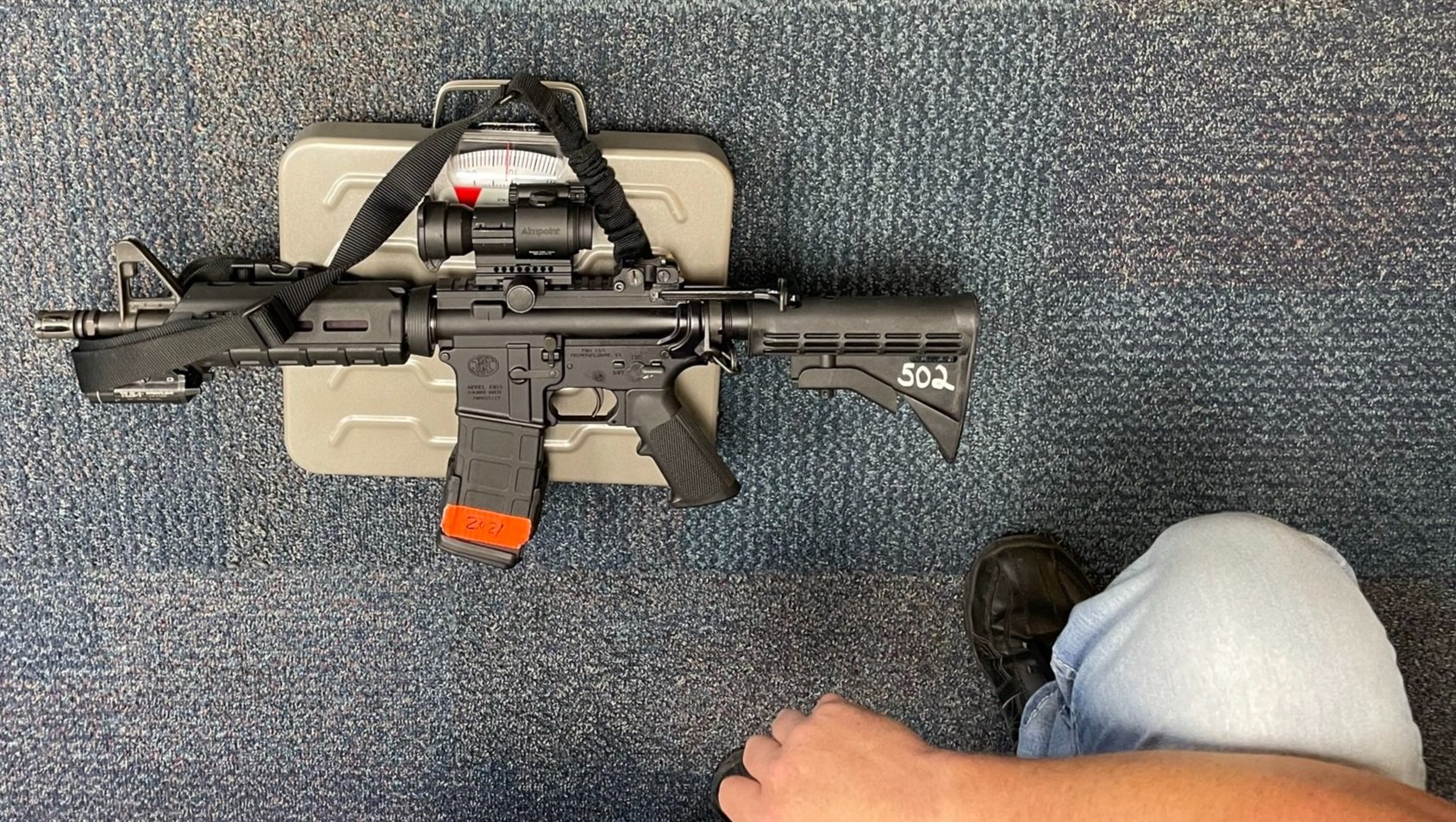 Physical demands analysis weighing weapons that the tactical officer may carry.