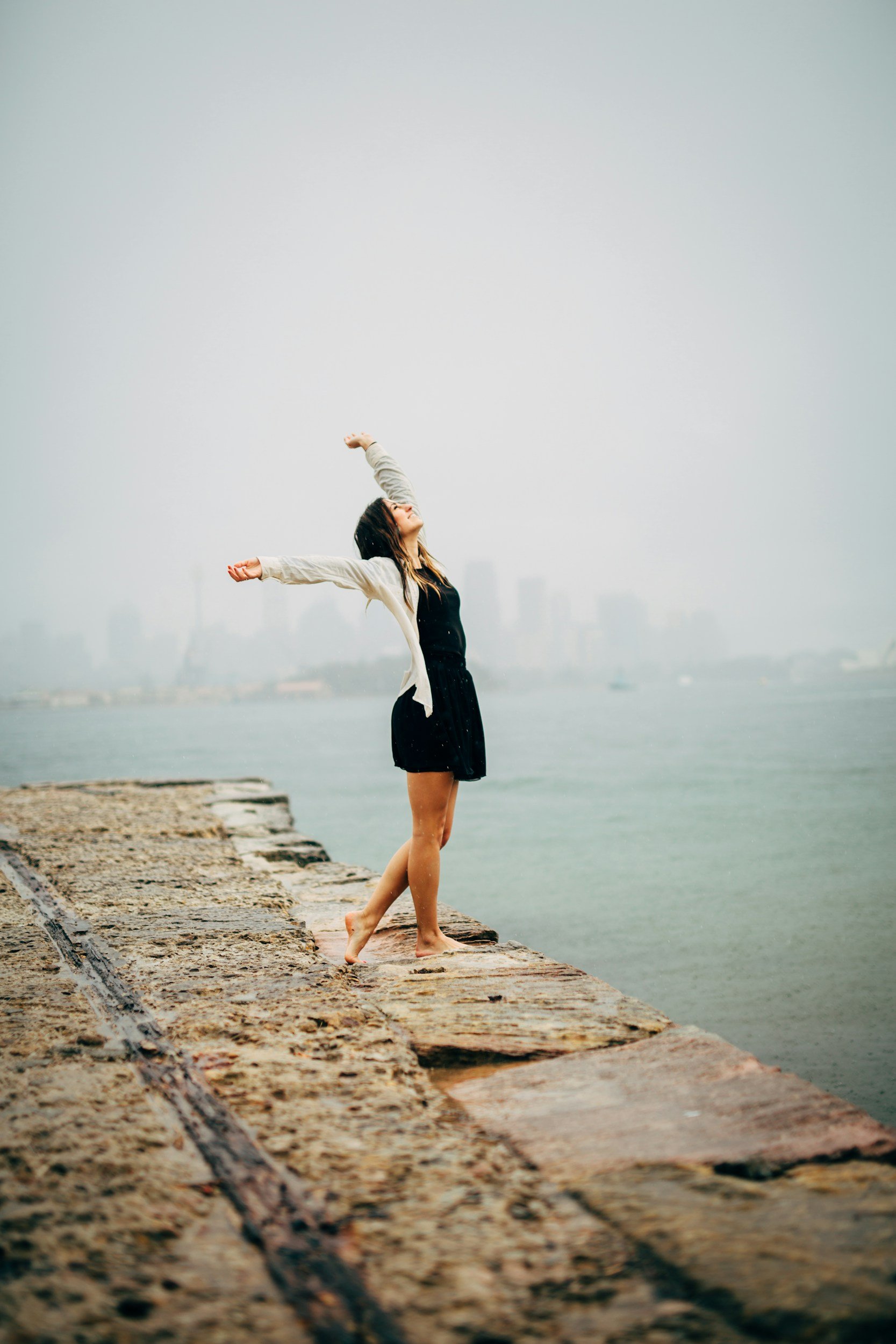Woman stretching by the lake, OCD Therapy, Burlington, Ontario