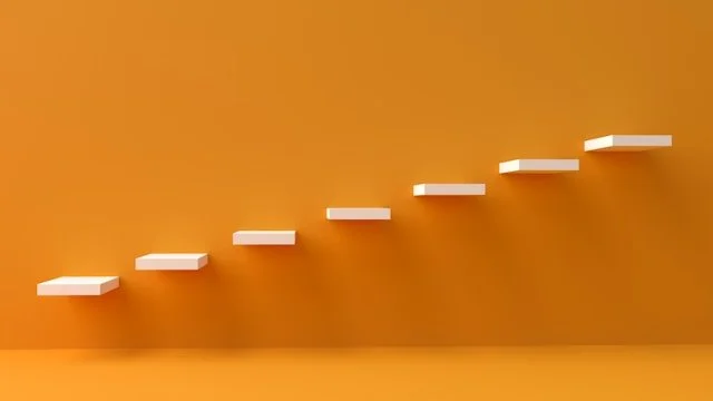 White steps on an orange wall