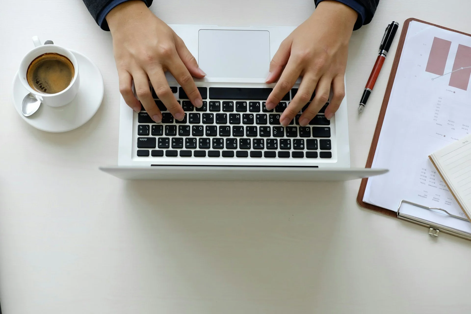 hand using a laptop computer with top view