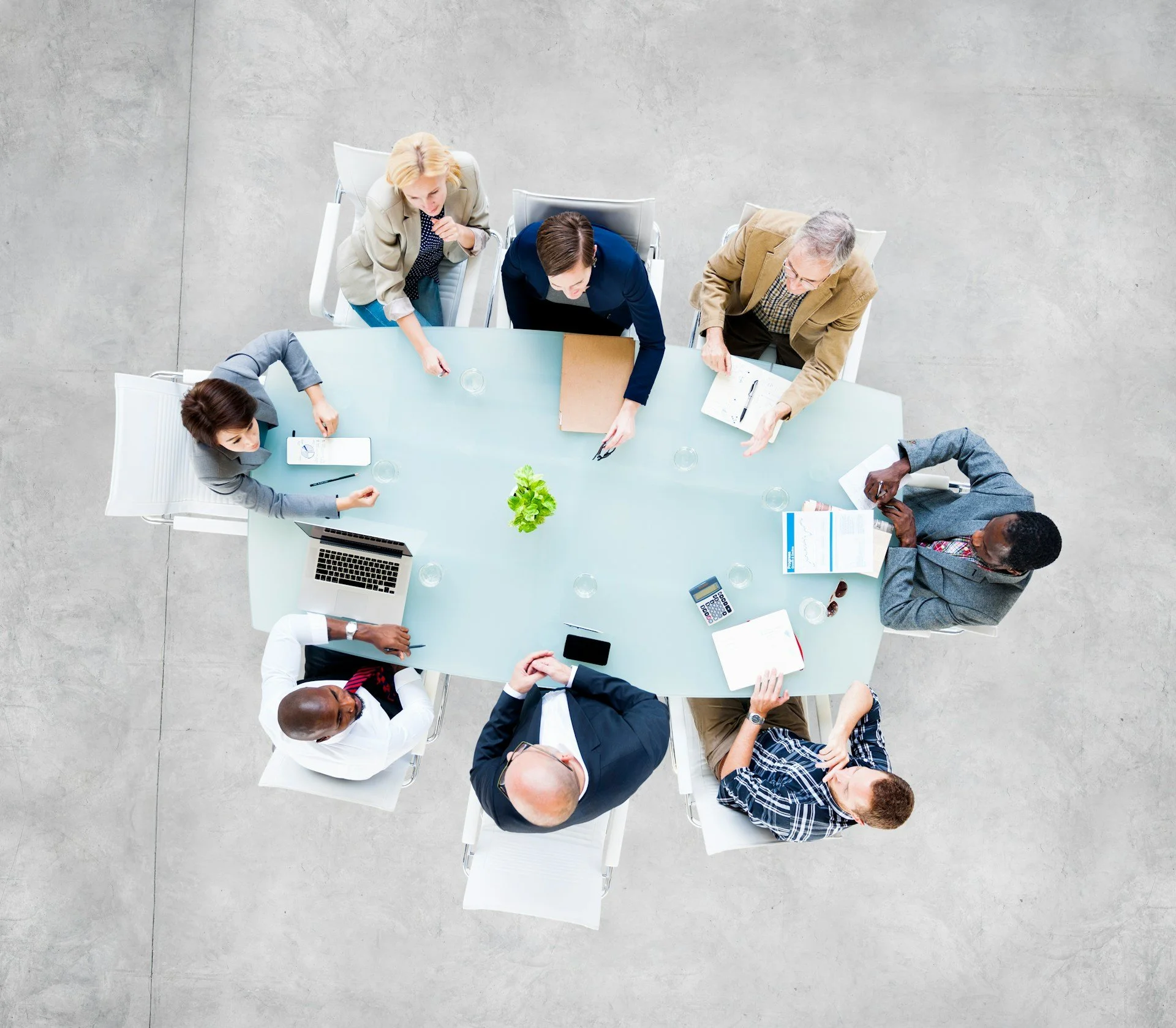Business people around meeting table