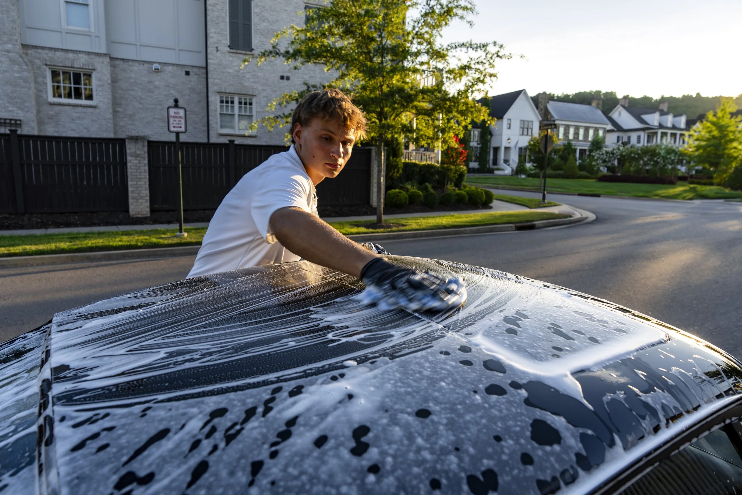 Late afternoon soap-and-sponge car wash — premium hand wash service by Reflections Perfection in Franklin, TN