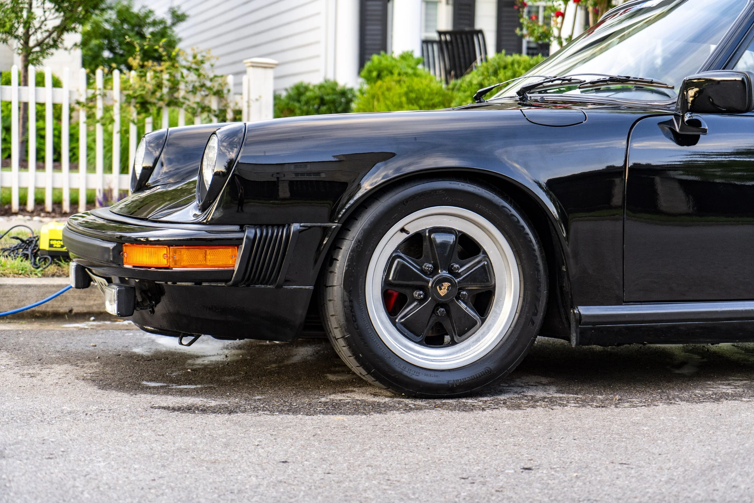 Porsche front-end detail — wheel and polish by Reflections Perfection in Franklin, TN.