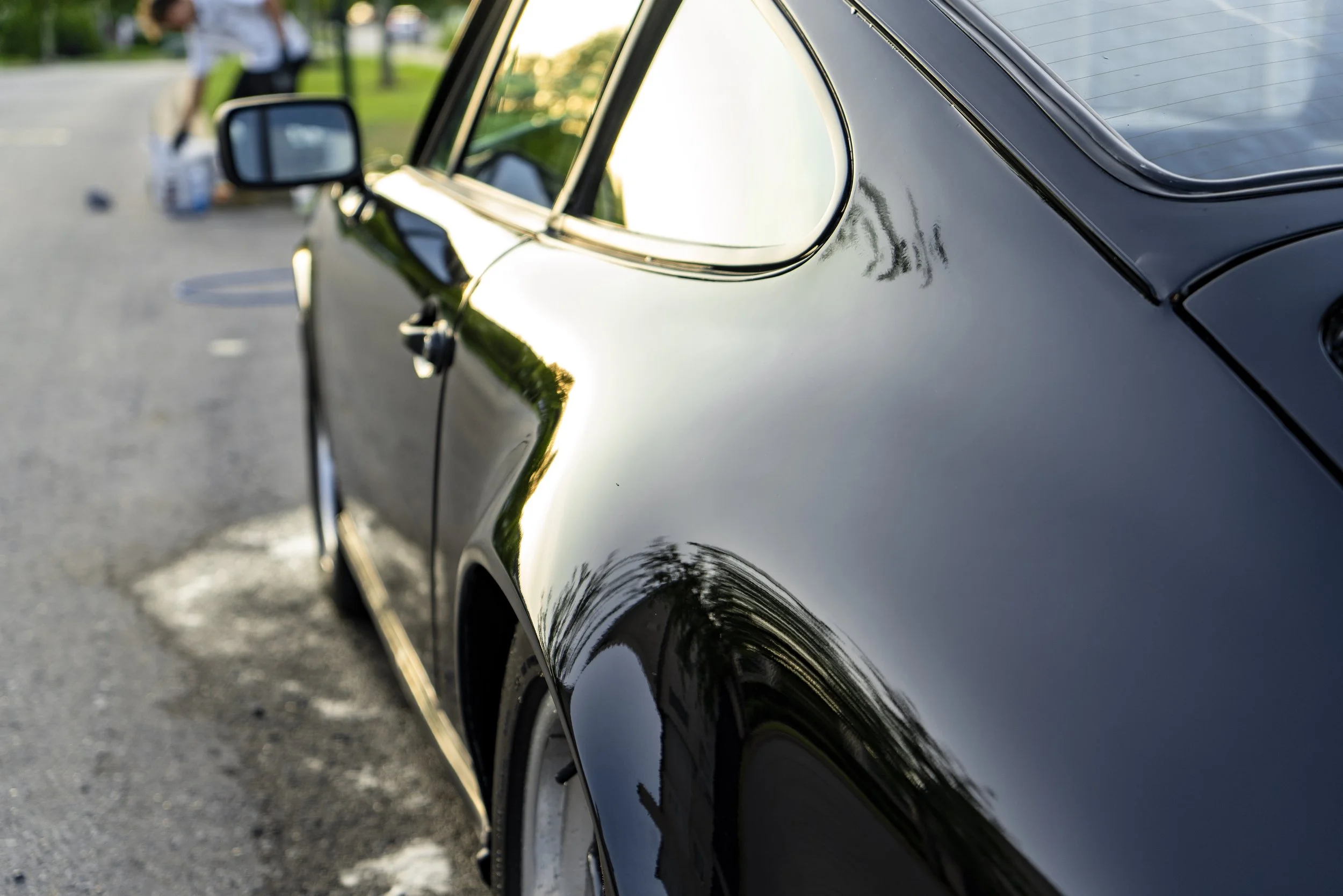 Glossy black hood with reflections — ceramic sealant applied by Reflections Perfection in Franklin, TN.