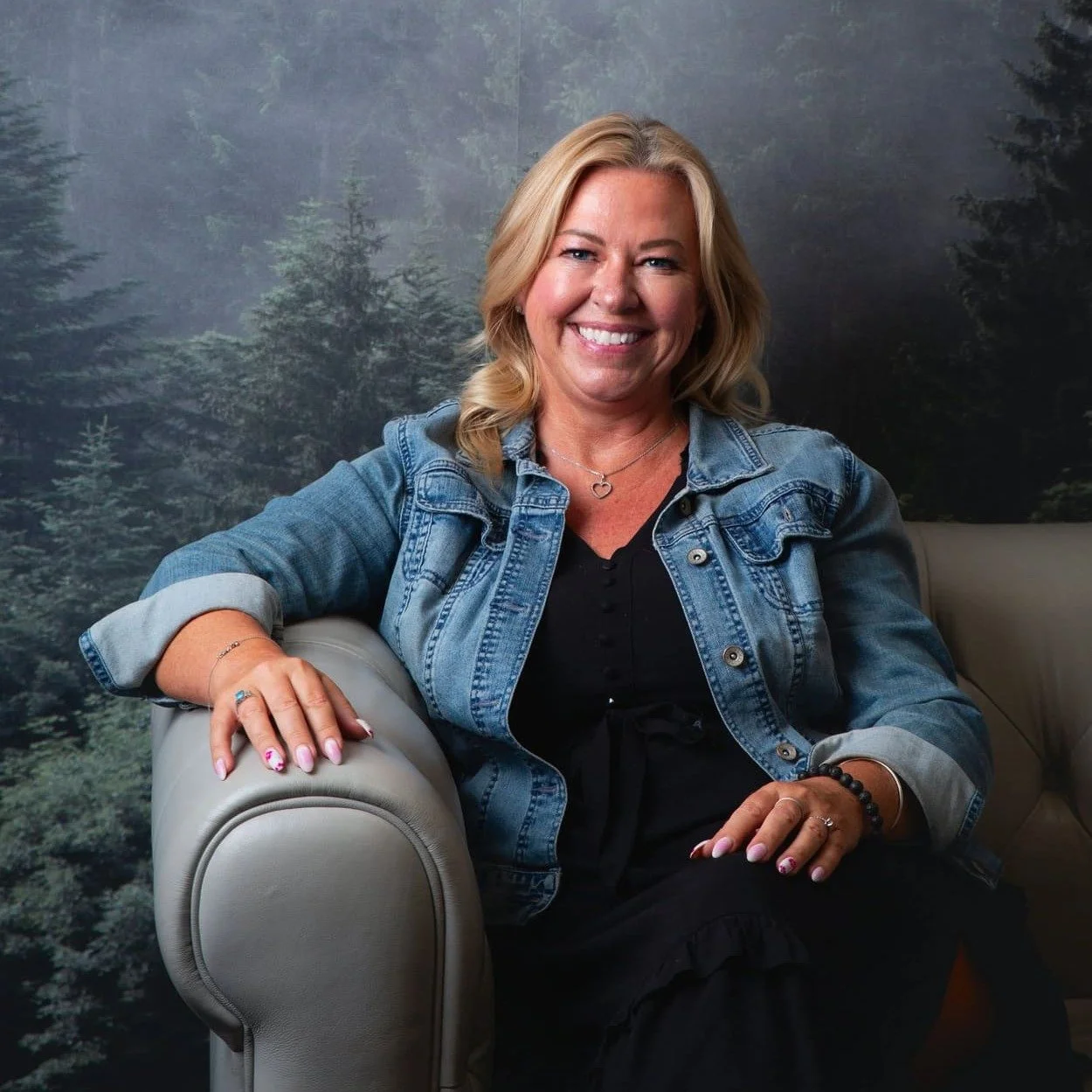 Christy Leeferink, Director at Psychology in the Park, seated on a couch