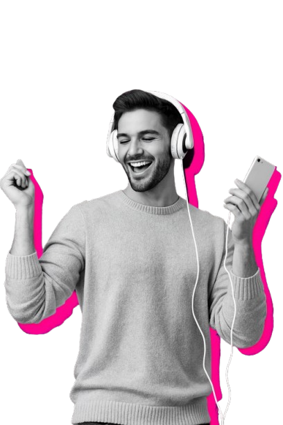 A young man with headphones enjoying music, smiling, and holding a phone.
