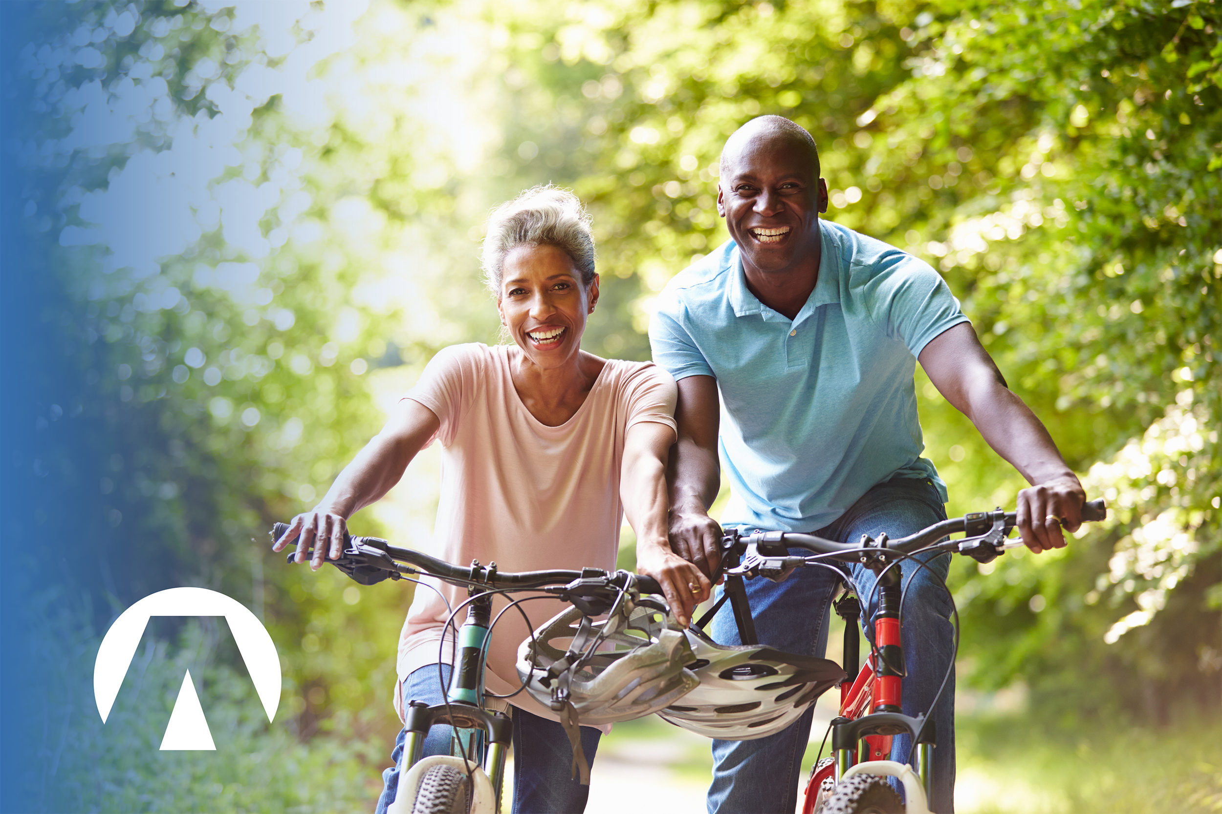 Smiling couple riding on bikes