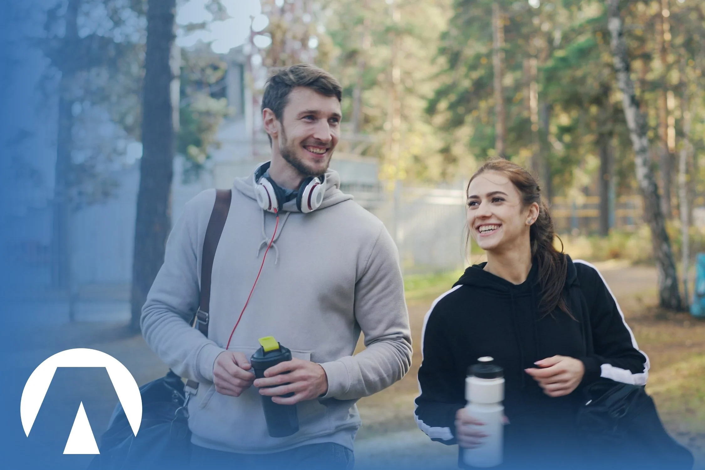 Two adults smiling while on a walk