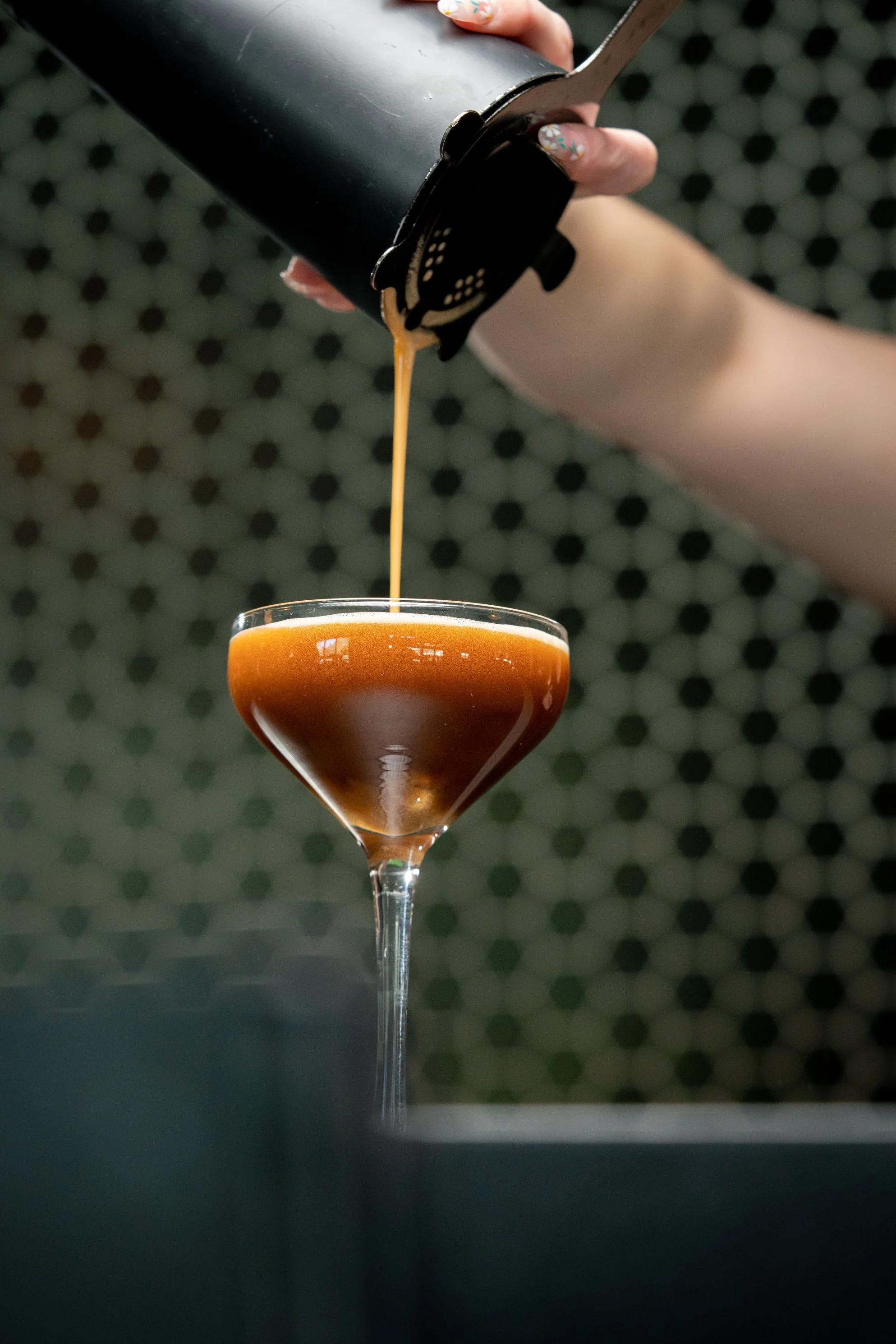 Pouring an espresso martini.