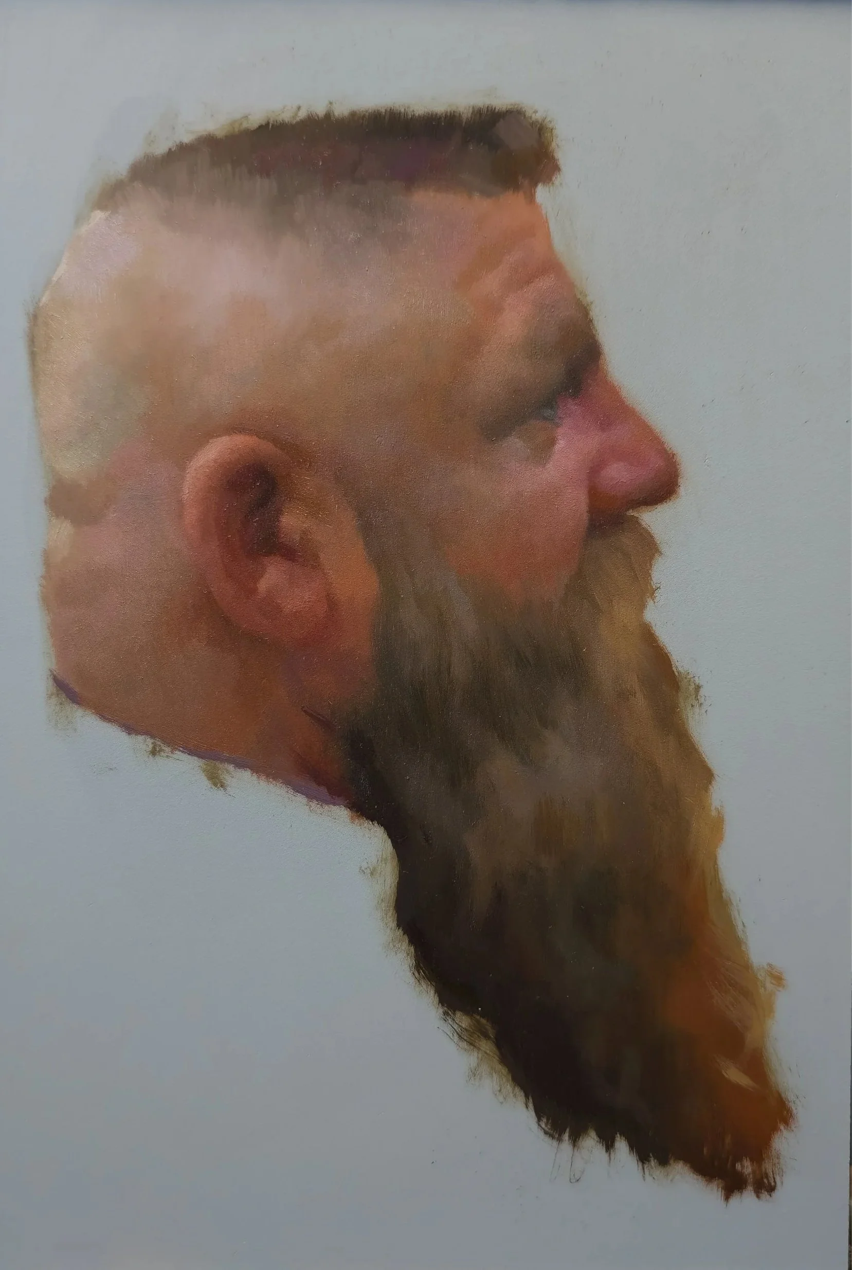 A watercolor painting of a bearded man in profile, with a short haircut and a serious expression, set against a light background.