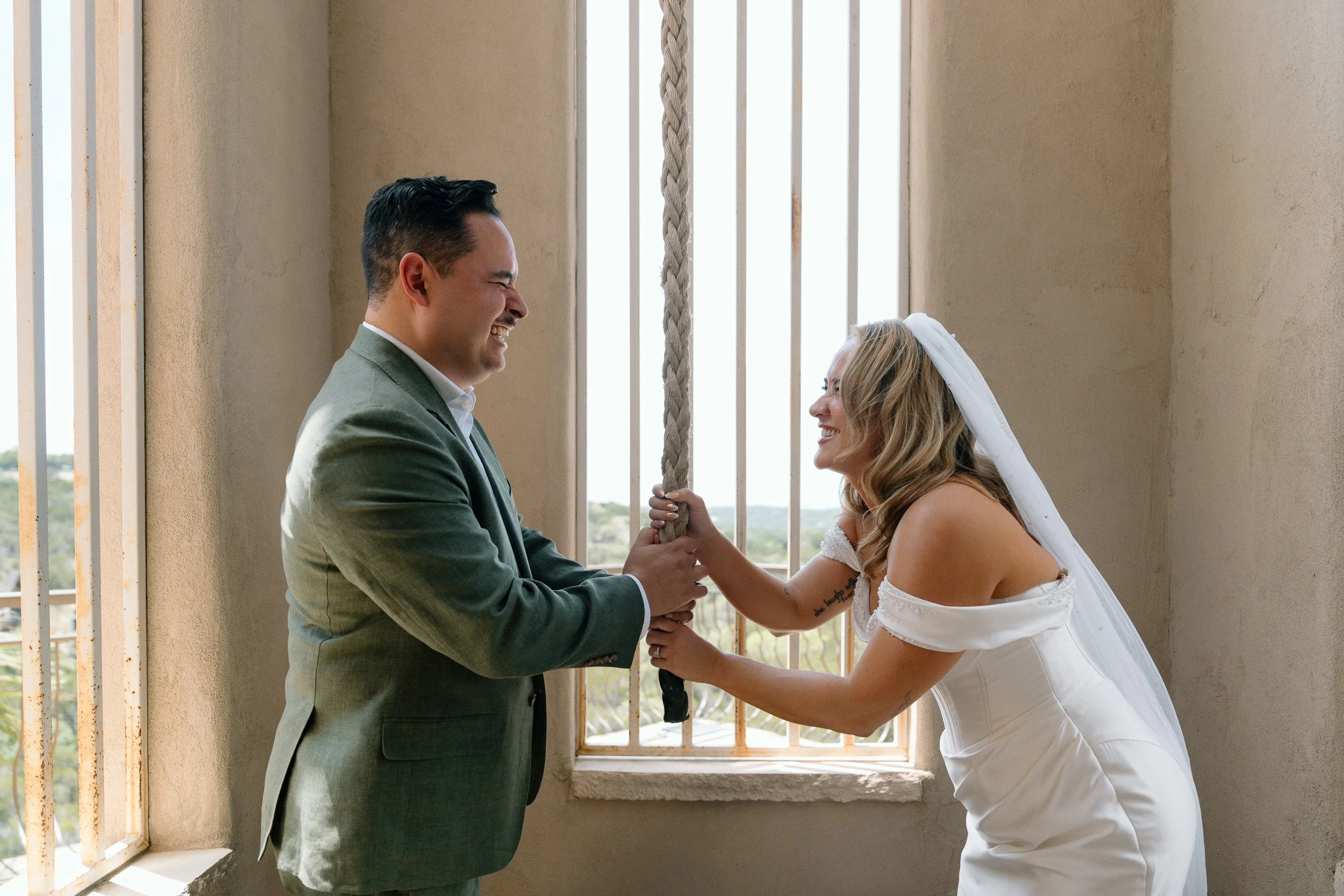 couple-ringing-bell-laughing.jpg