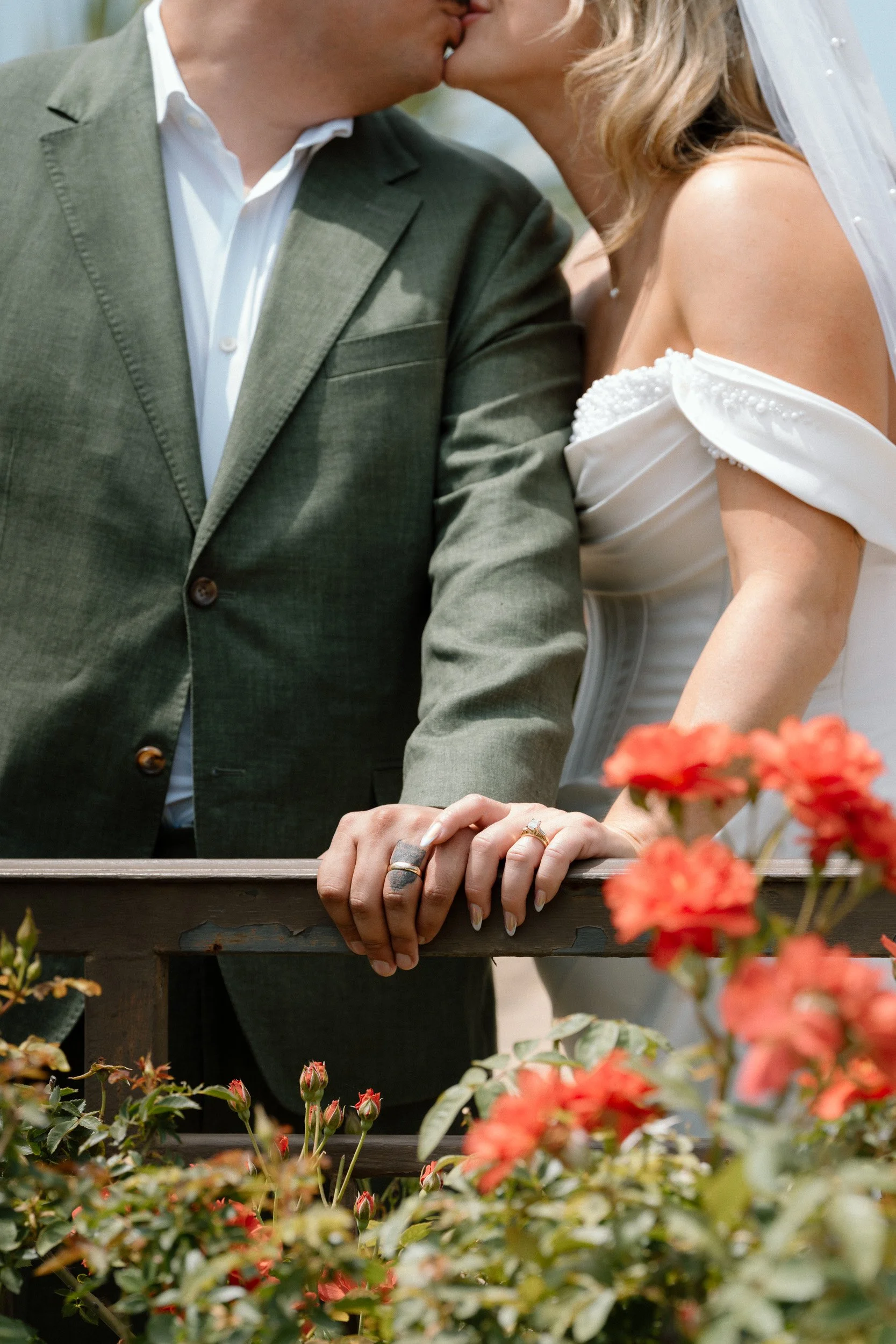 couple-kiss-roses-wedding-rings.jpg