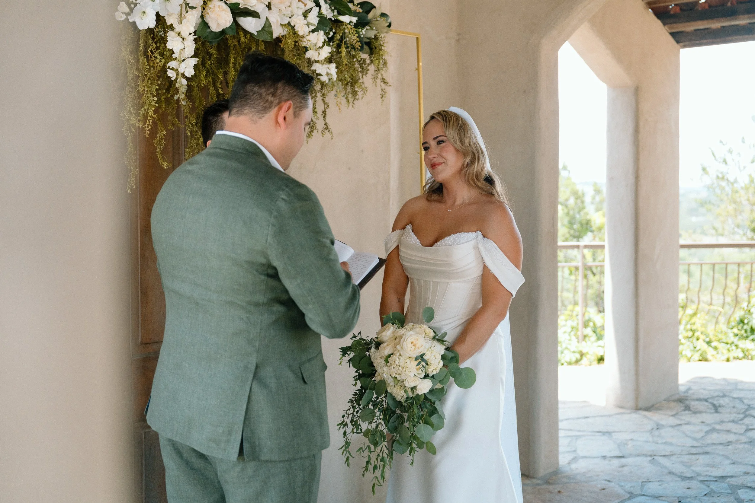 bride-listening-vows-ceremony.jpg