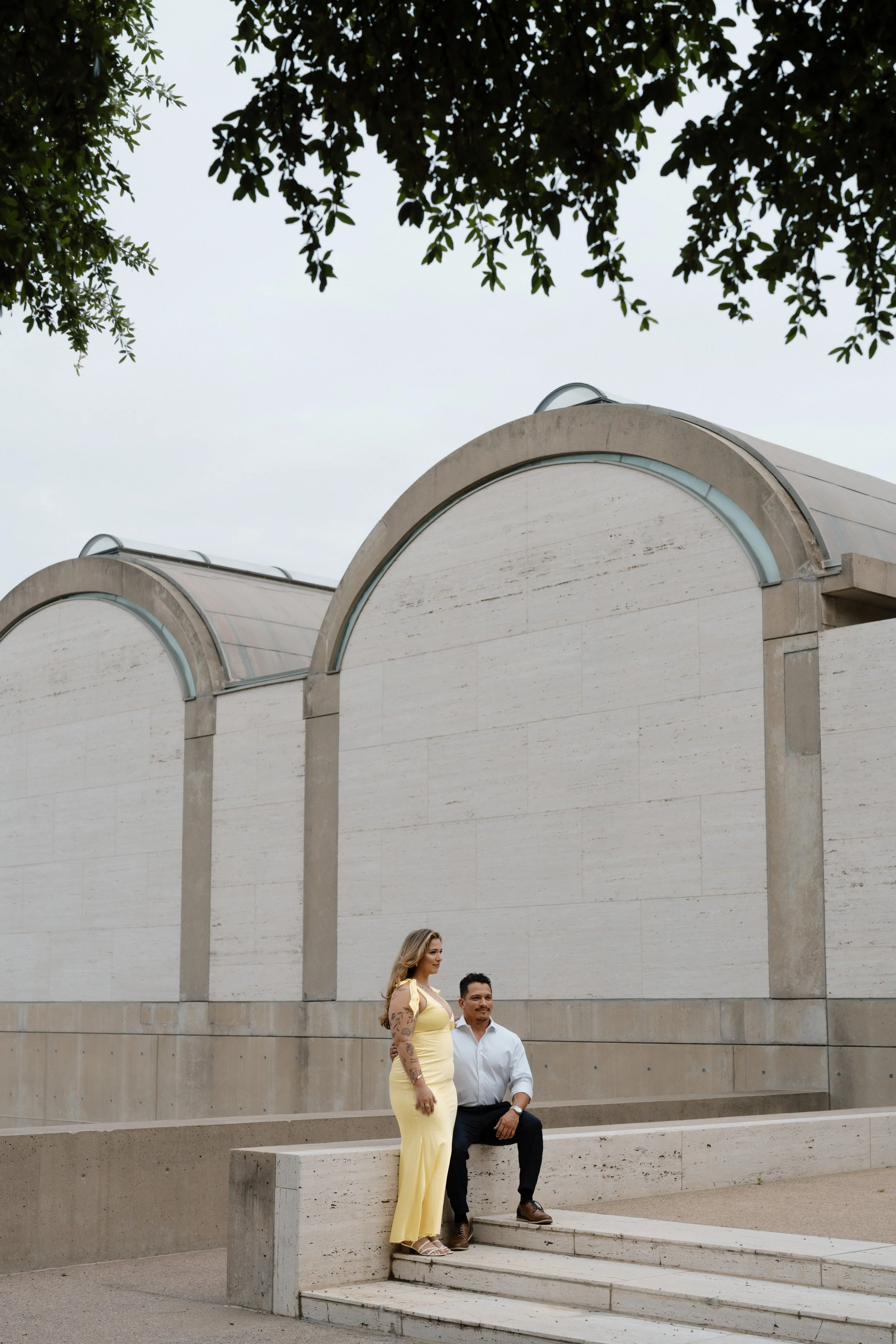 Editorial image of a couple at Fort Worth proposal at Kimbell Art Museum