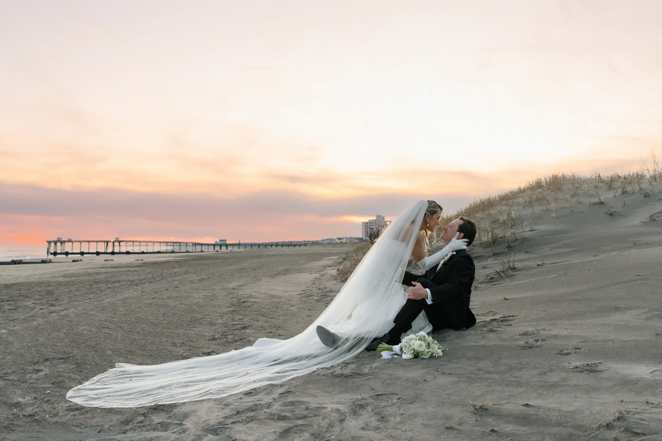 Bride and groom on the beach in New Jersey outside The Flanders Hotel