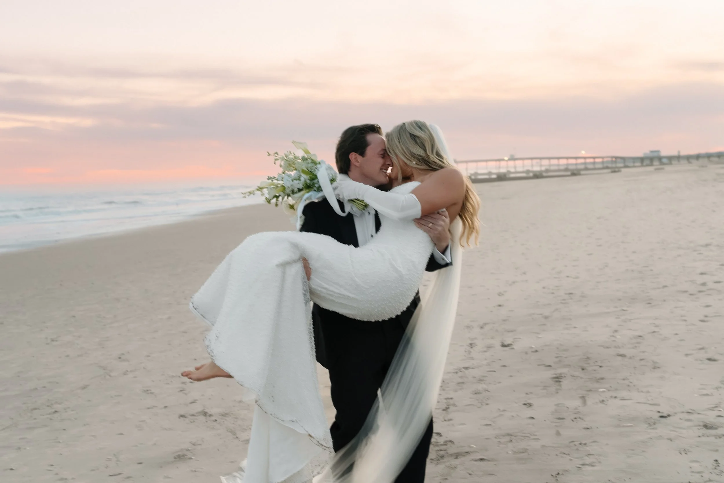 Wedding couple on a New Jersey beach for wedding photos