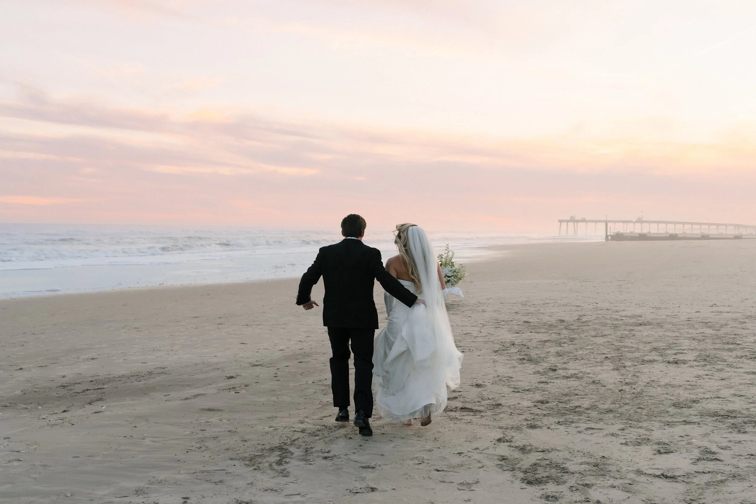 Bride and groom on a beach in Ocean City, NJ