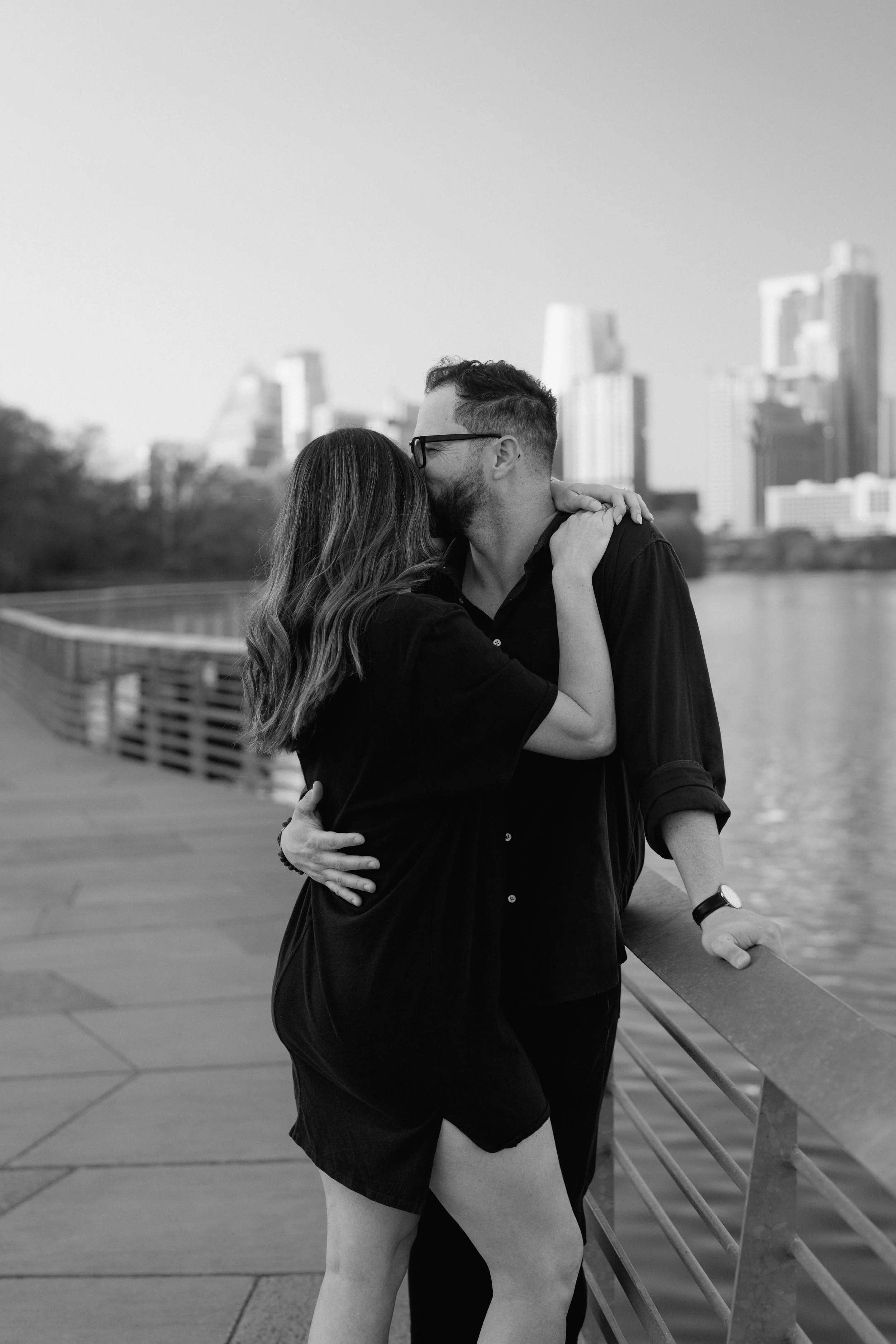 Couple embrace during Austin engagement photos at Lady Bird Lake