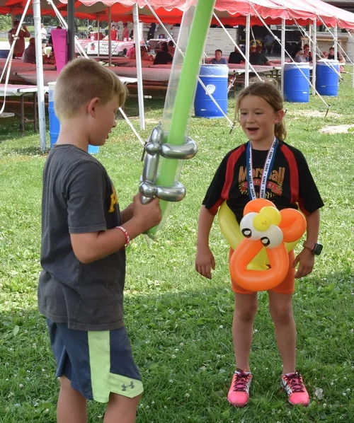 Twisted balloon sword and duck hat