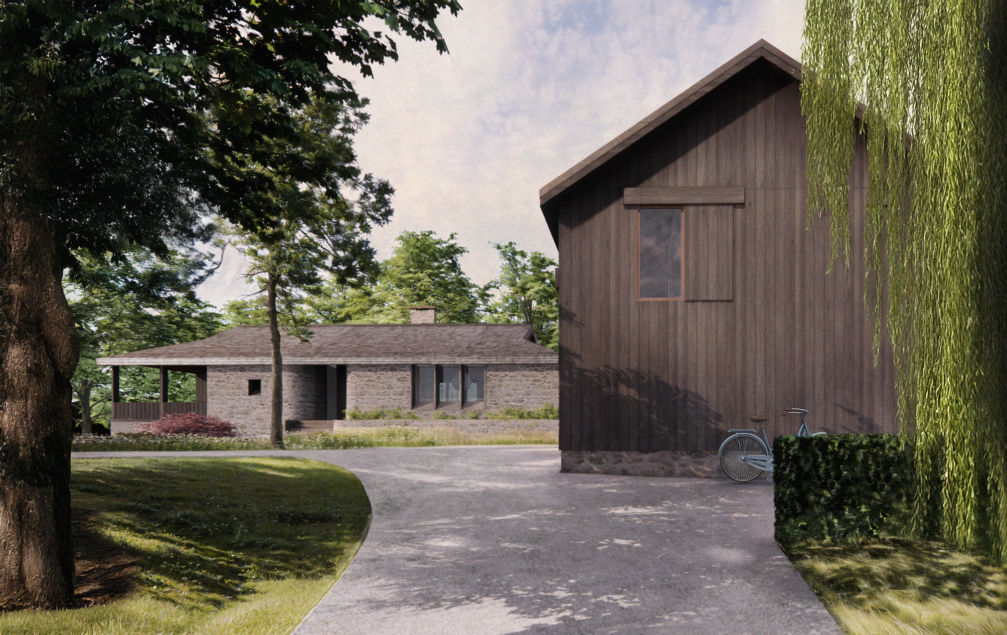 View of two houses surrounded by trees and greenery, with a gravel driveway and a bicycle leaning against a hedge.