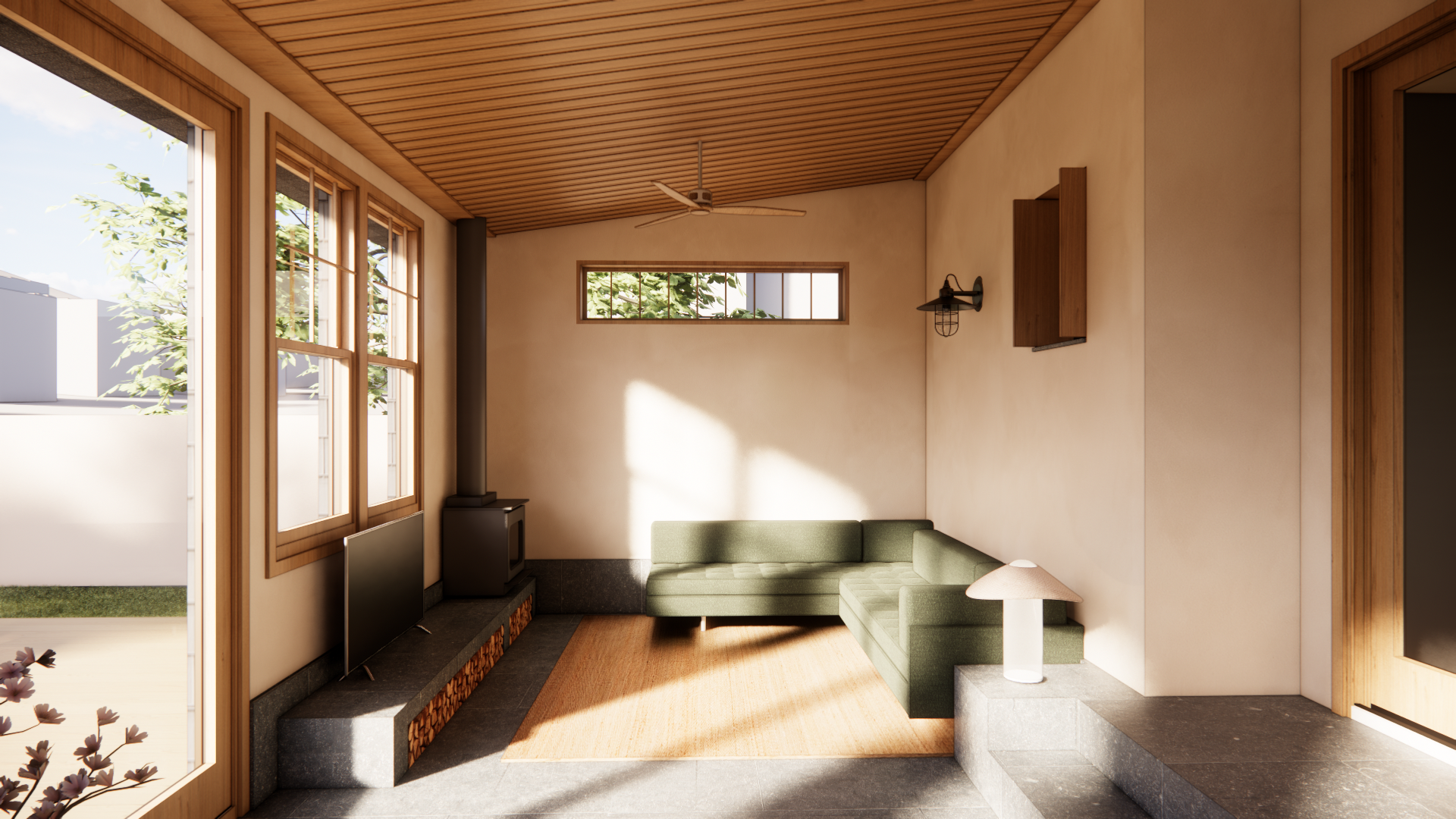 Interior of a modern living space with wooden walls, ceiling, and furniture, including a round wooden dining table with a vase holding flowers, a dark green sectional sofa, and large windows letting in natural light.