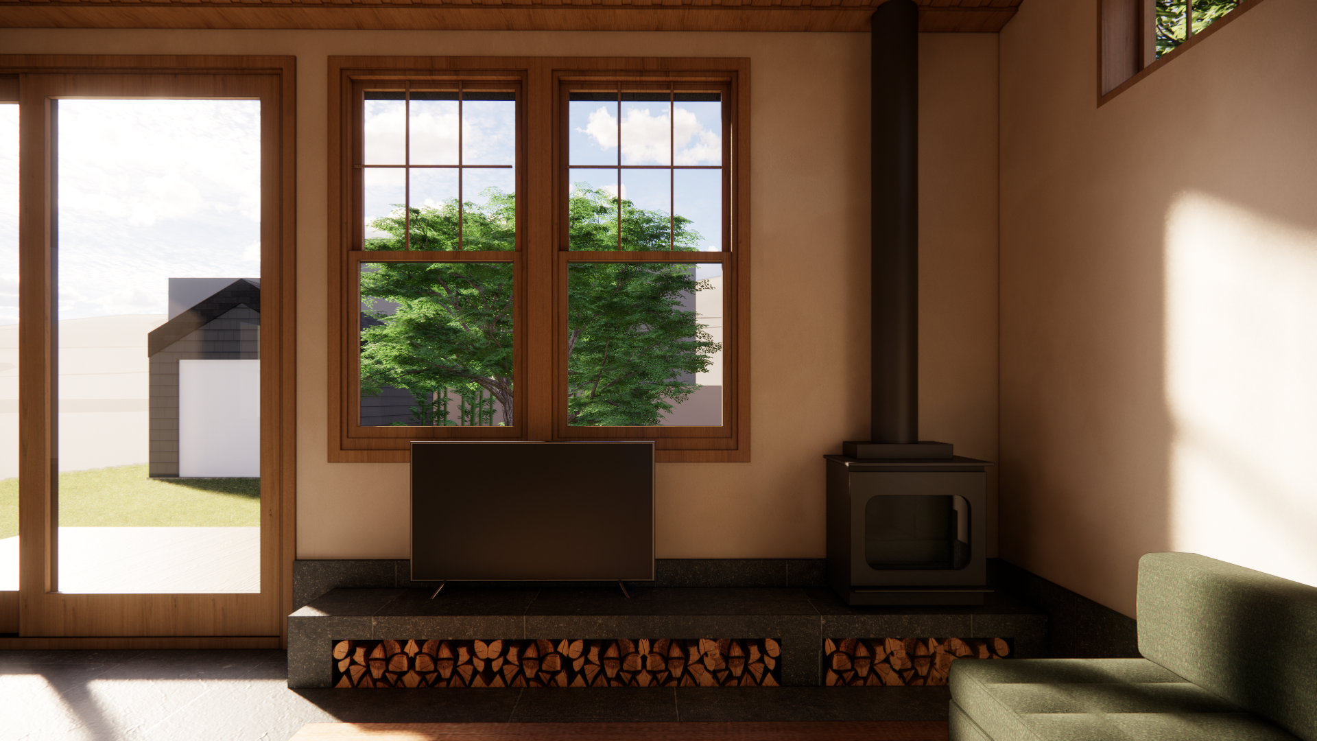 A cozy living room with large window showing outside greenery, a small black wood stove, a television on a black stand, and an olive green sofa. Sunlight streams in, casting shadows on the wall.