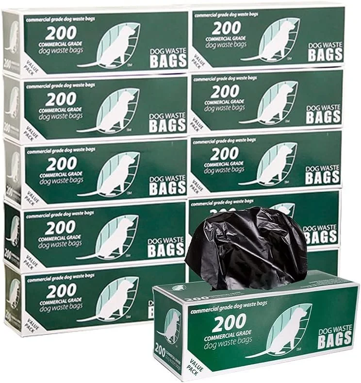 Box of 200 green commercial grade dog waste bags with a black trash bag placed on top