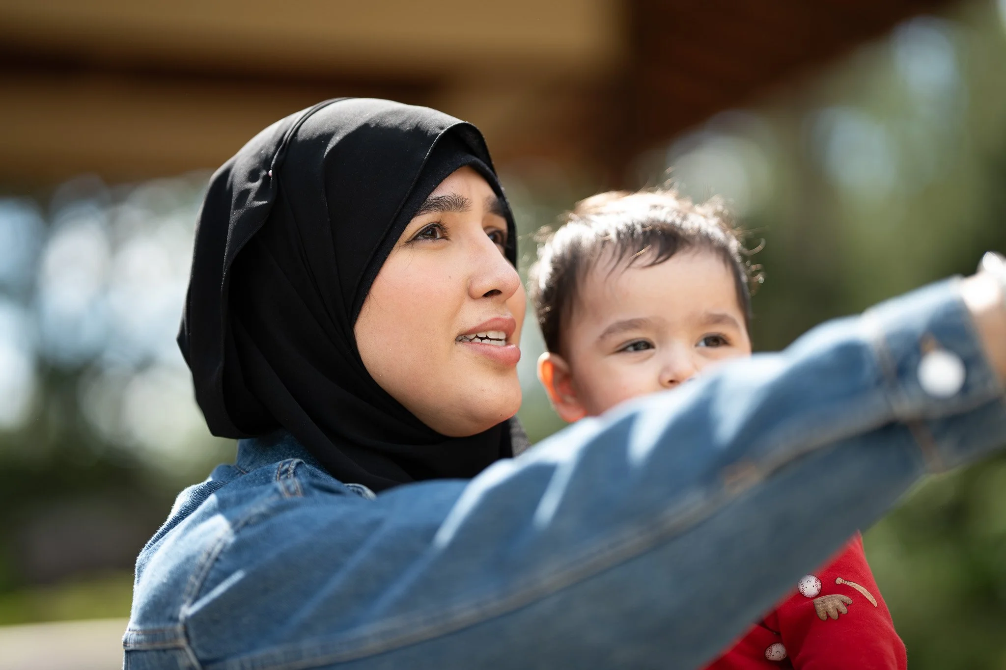 A woman and her son looking far into distance
