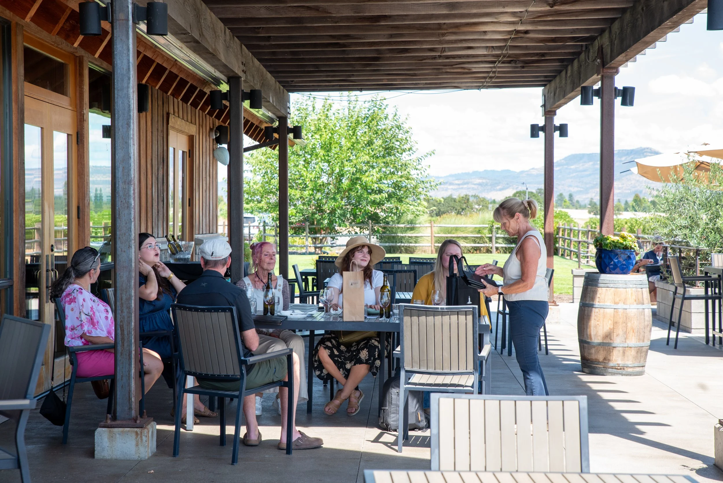 Guests enjoying a wine tasting moment in the Rogue Valley