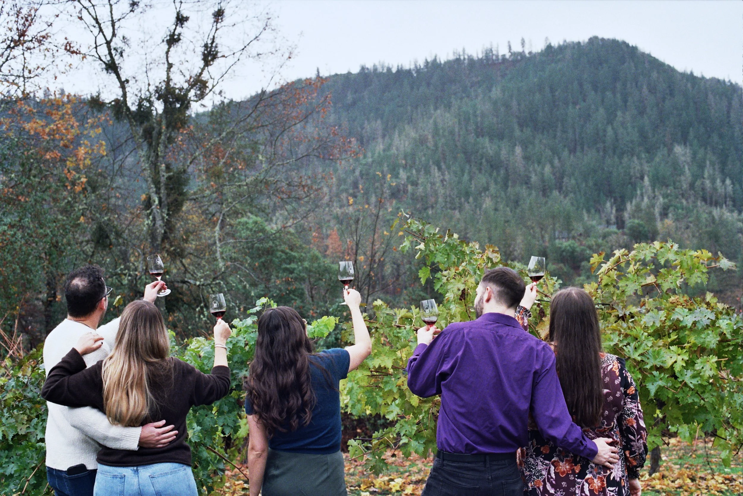 Visitors enjoying a wine tasting experience in the Rogue Valley