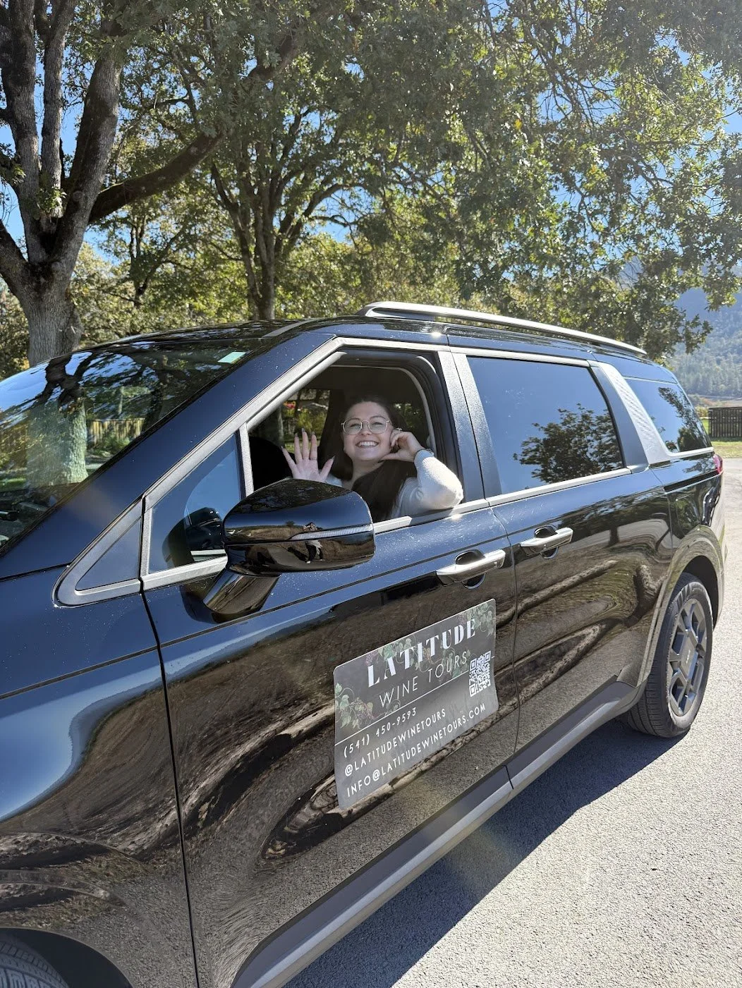WSET Level 3-certified wine educator and driver waving from the tour van.
