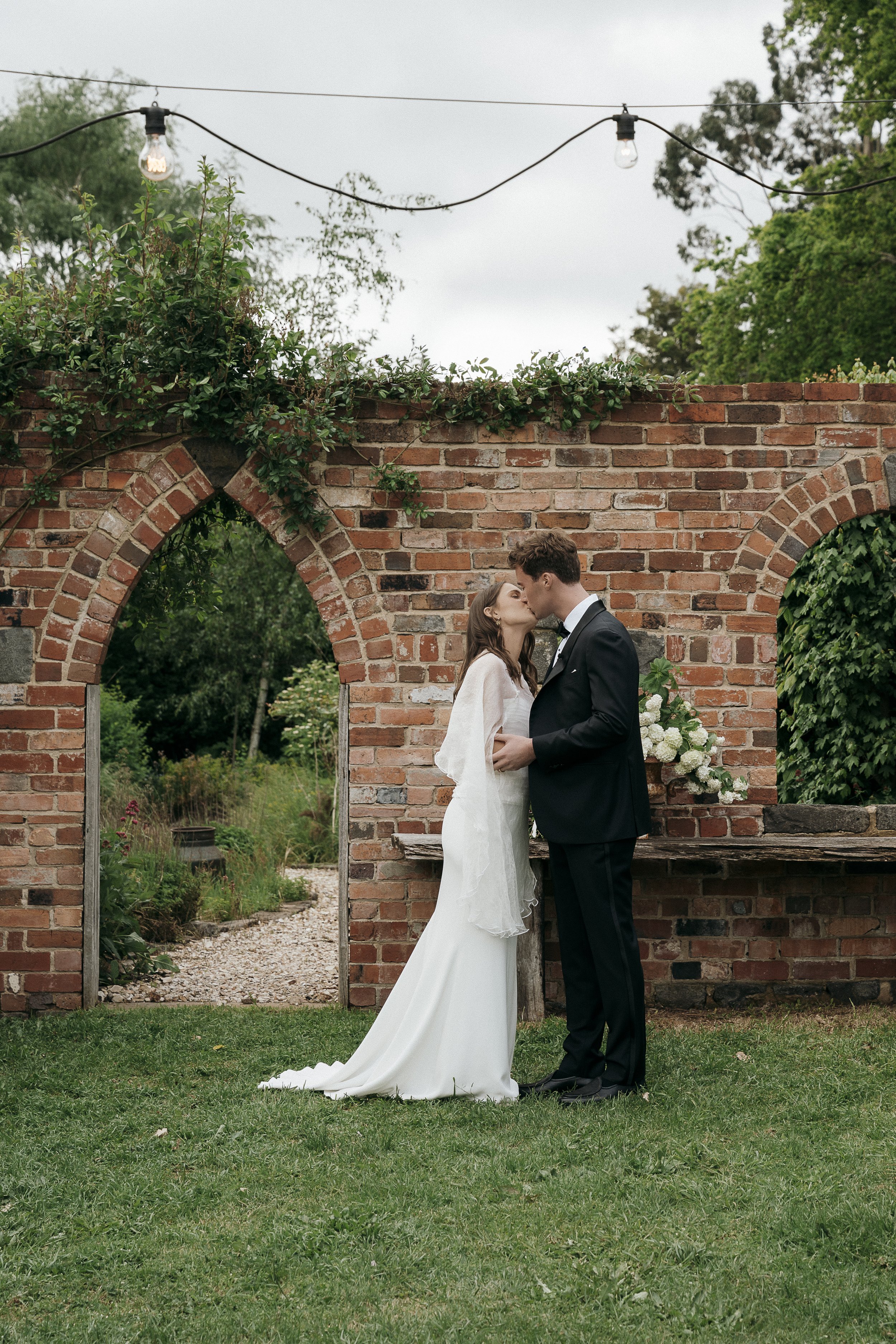 The moment the couple is pronounced married in the garden at Acre of Roses