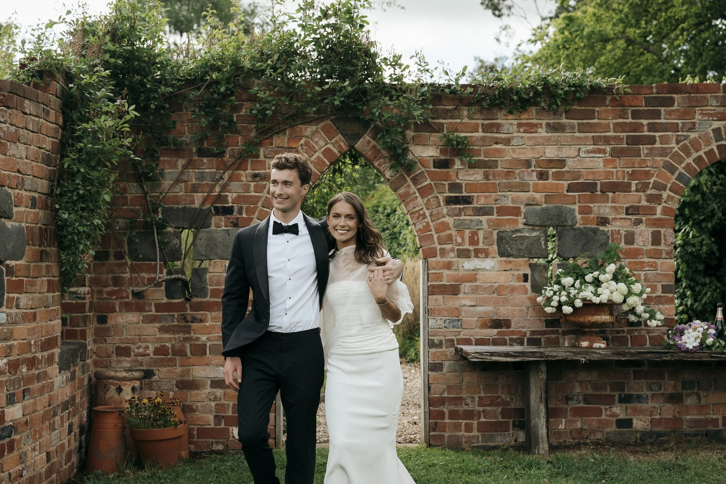 Couple walking through the gardens at Acre of Roses in Trentham