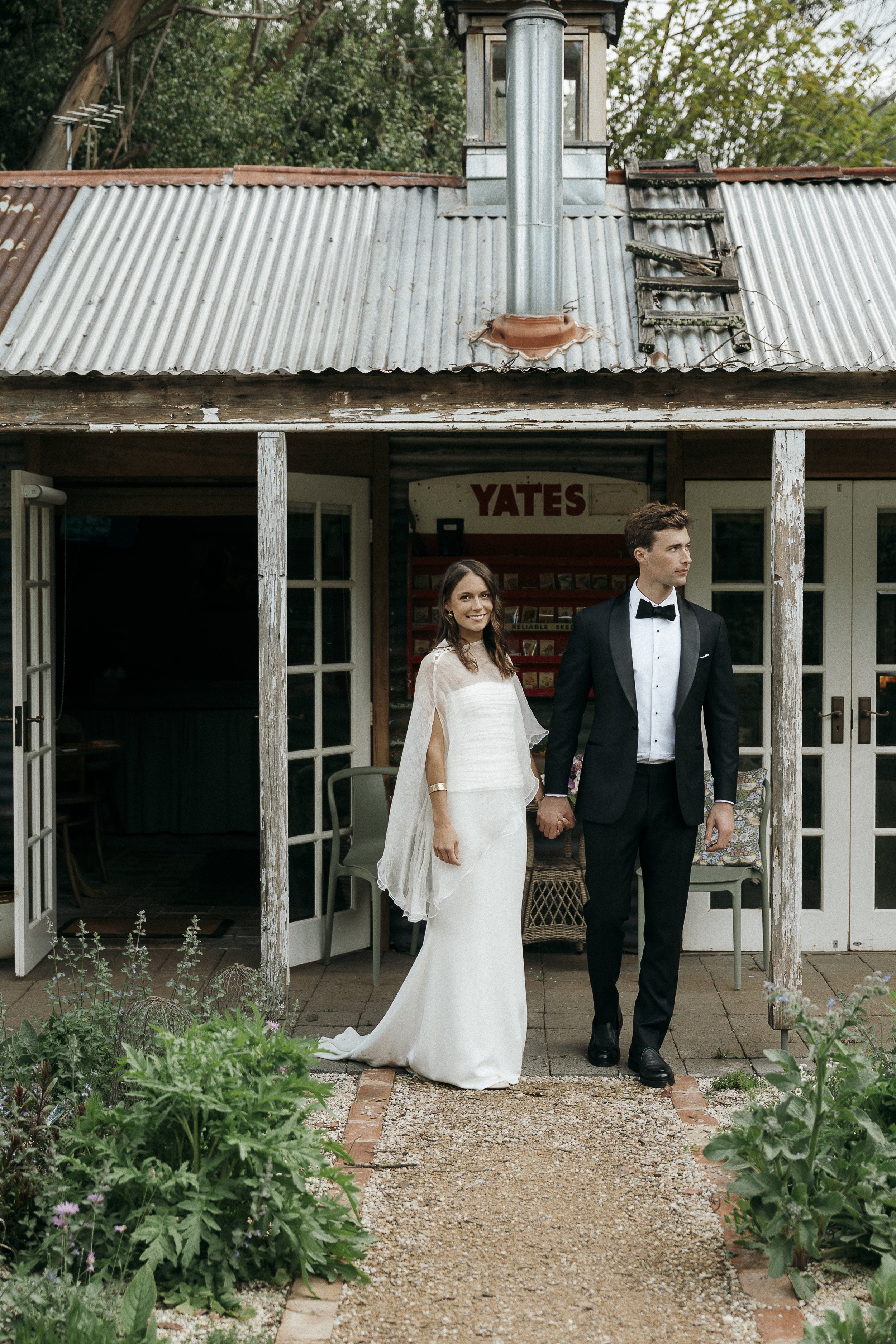 Newlywed portrait among greenery with modern, elegant styling