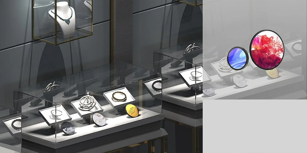 Circular LCD displays mounted above a jewellery counter in a luxury store