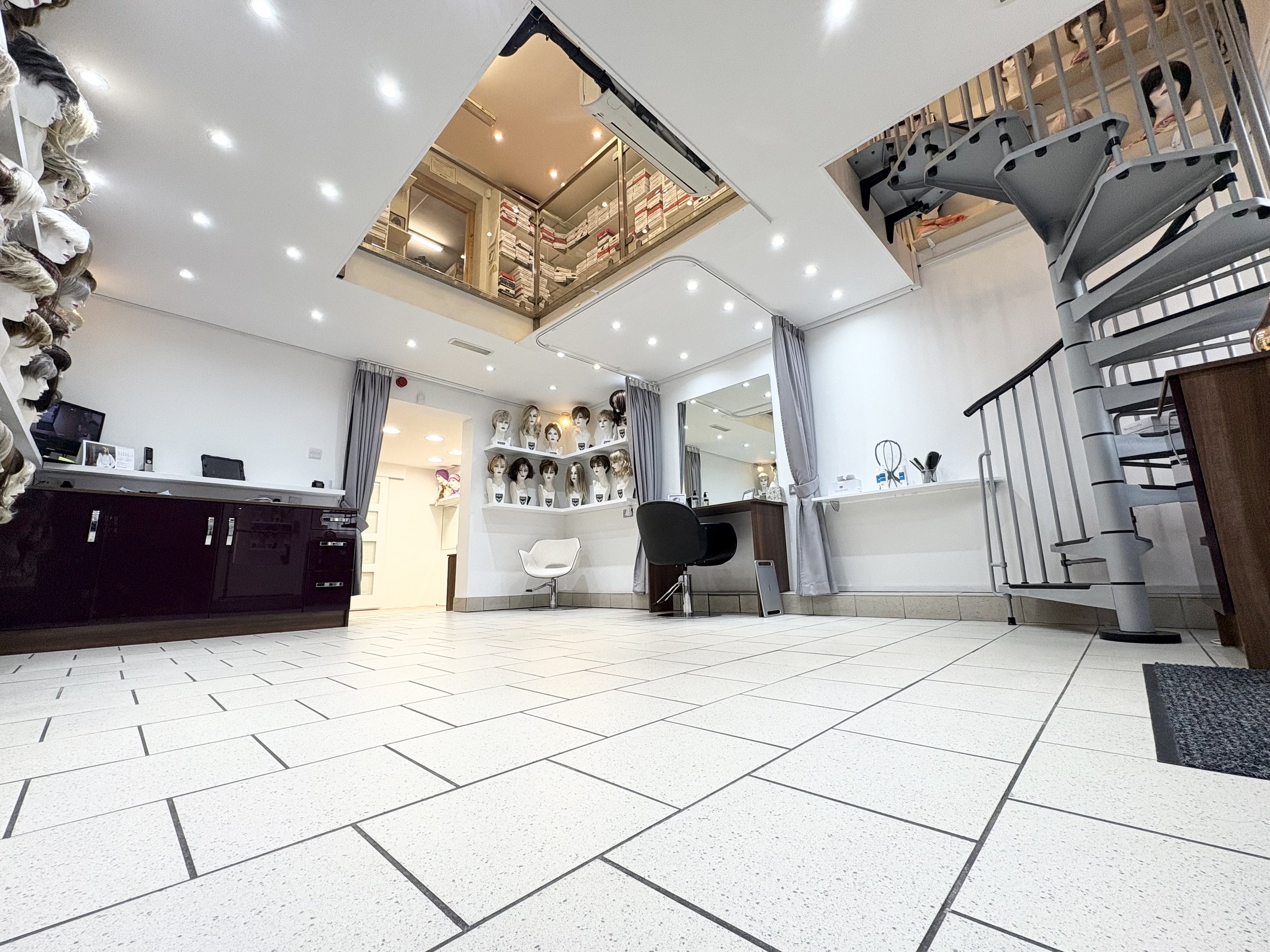 Multiple private fitting rooms supporting our appointment-only service.