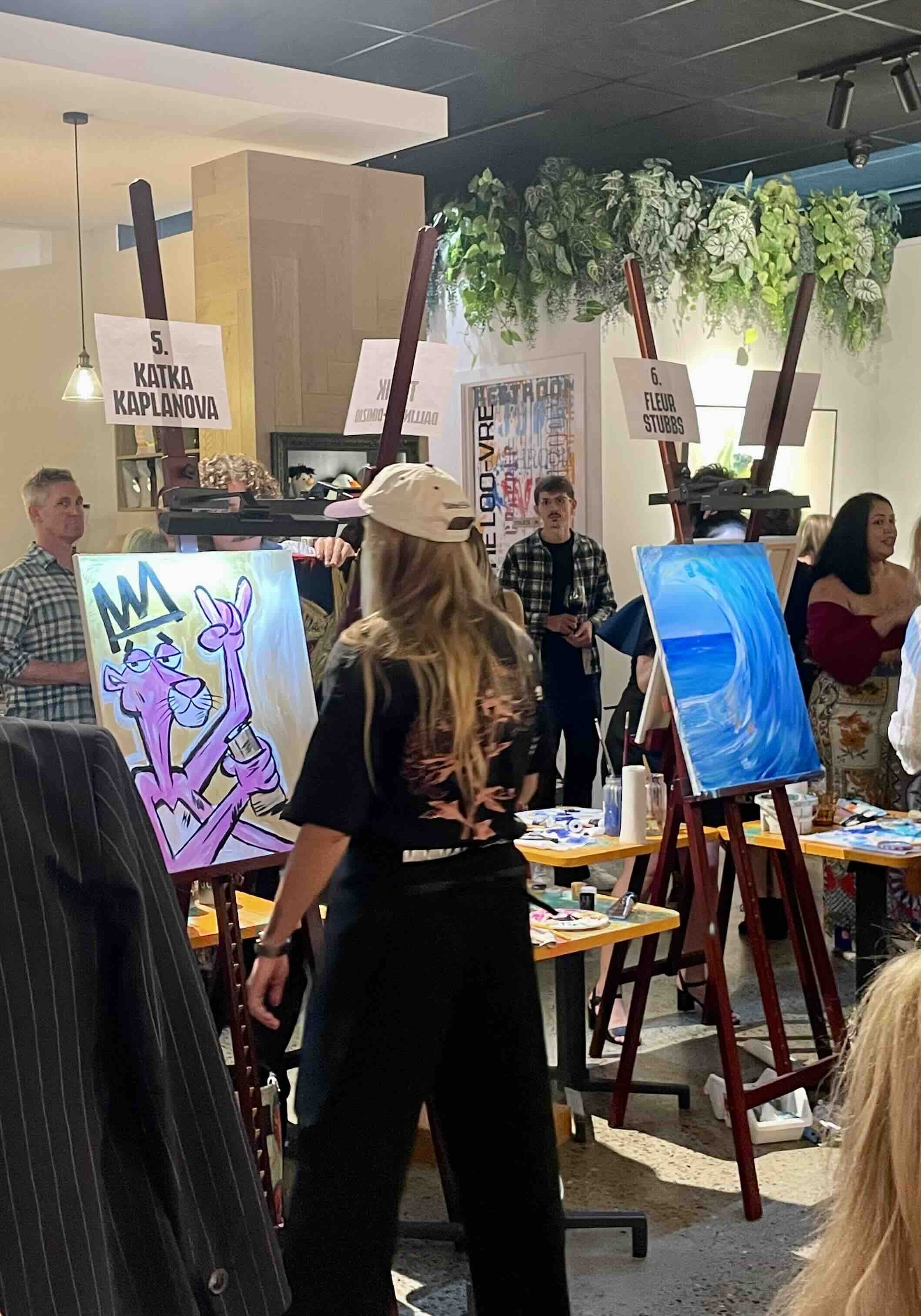 Artist live painting at the Pop Up Exhibition
