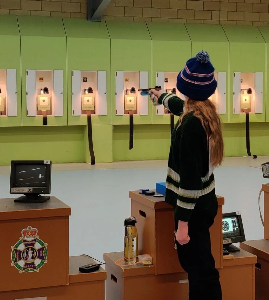 pistol shooter at indoor event