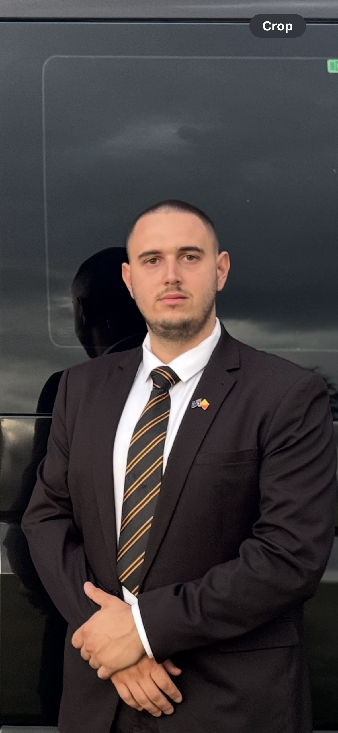Professional chauffeur in Perth – suited driver ready for luxury transfers and corporate hire.