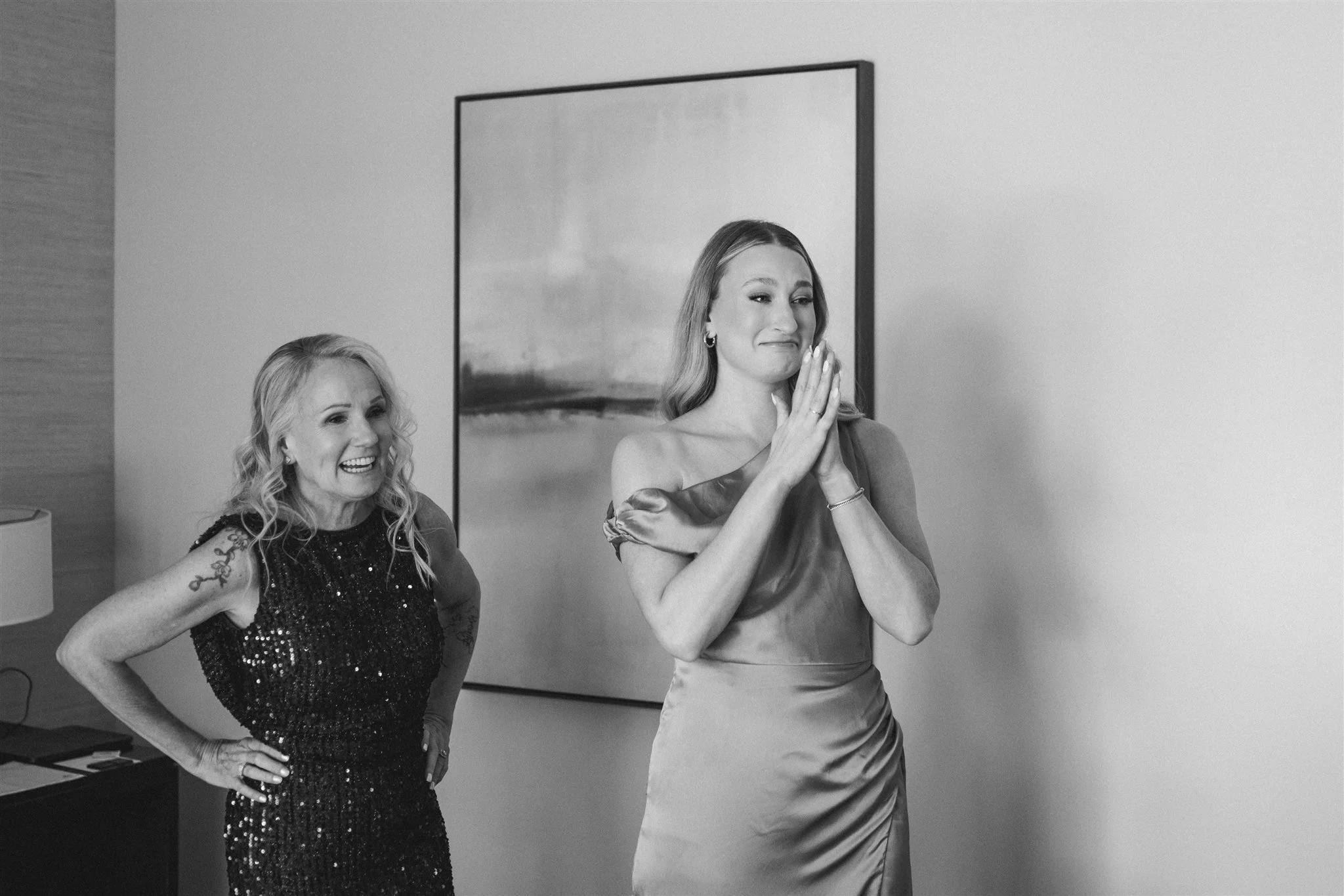 Black and white photo of bride reacting with excitement during wedding morning getting ready at Edgewood Tahoe Resort, Lake Tahoe