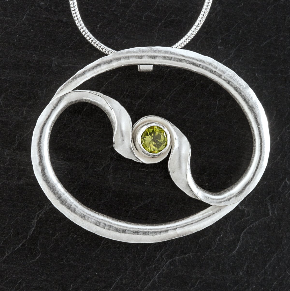 Embrace 2-arm pend peridot front sq 1200.jpeg