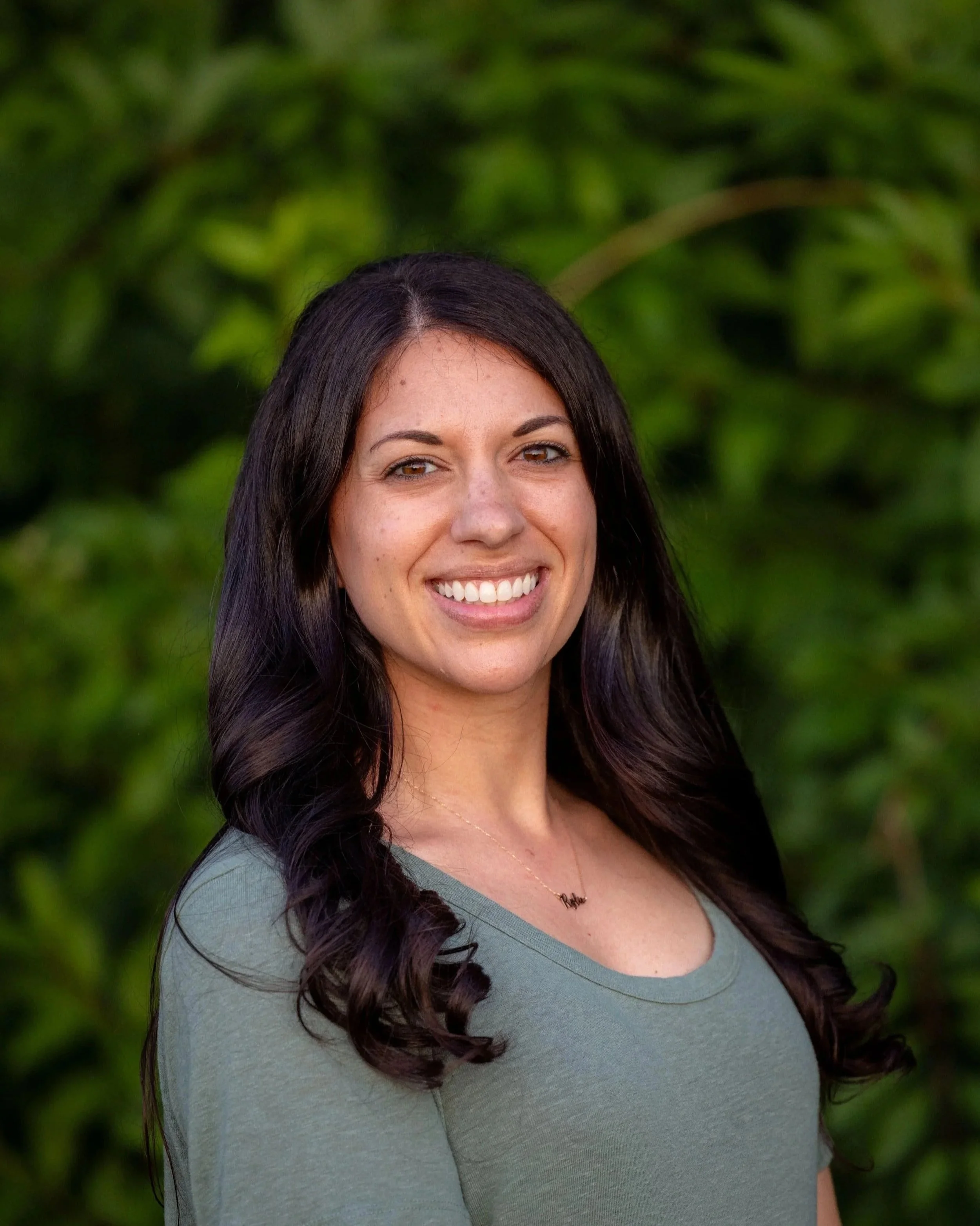 Portrait of Michelle, founder of  Rise Above LLC.