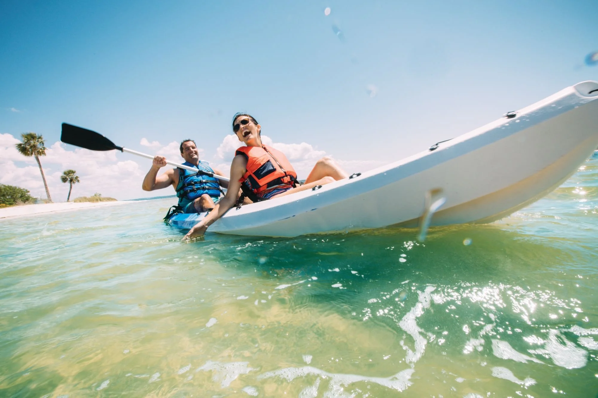 A couple enjoying a kayak ride in the Gulf near Panama City Beach, Florida
