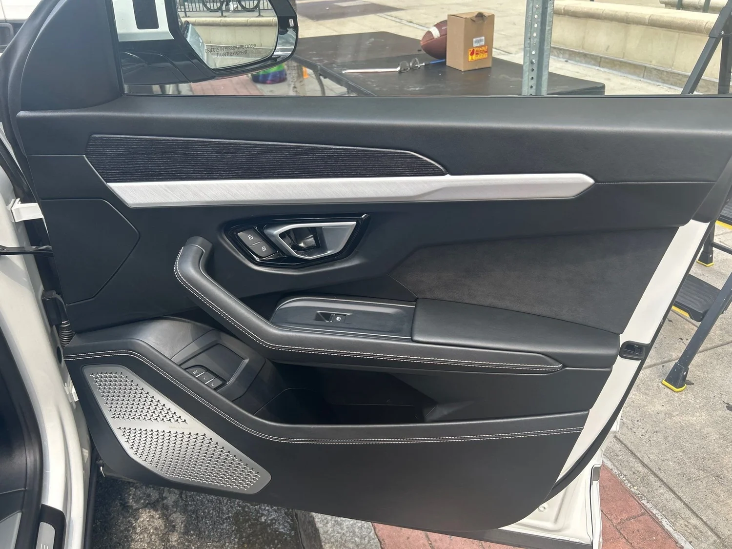 Clean black Lamborghini door after Full Essentials detail in Port Chester, NY