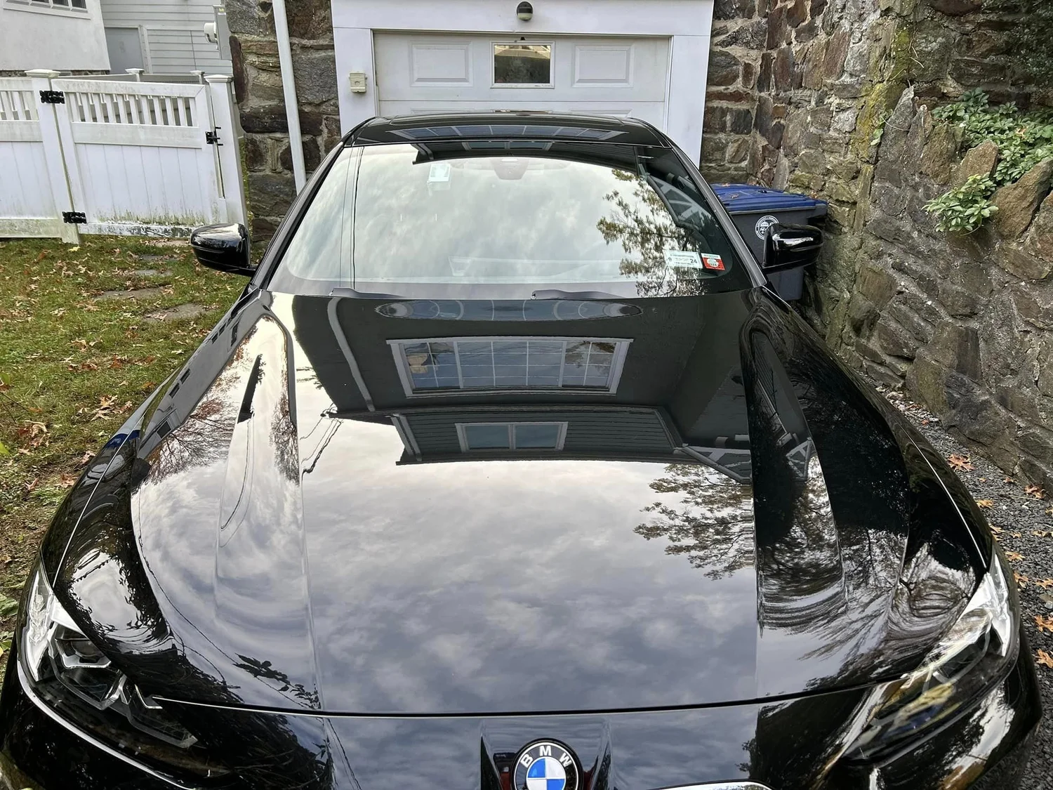Black BMW sedan with deep gloss finish after Exterior Essentials in Cos Cob, CT