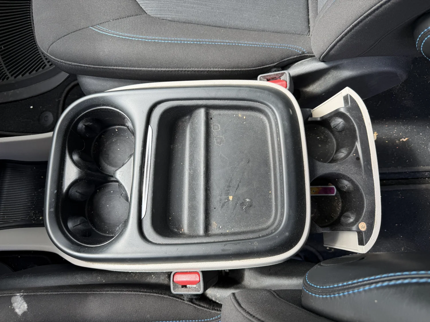 Interior cup holders and console before deep cleaning