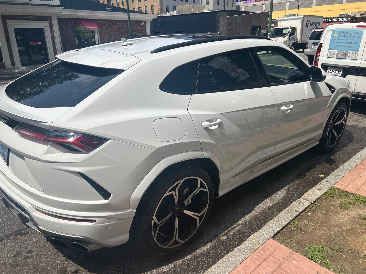 White Lamborghini SUV after Exterior Essentials detail in Scarsdale, NY