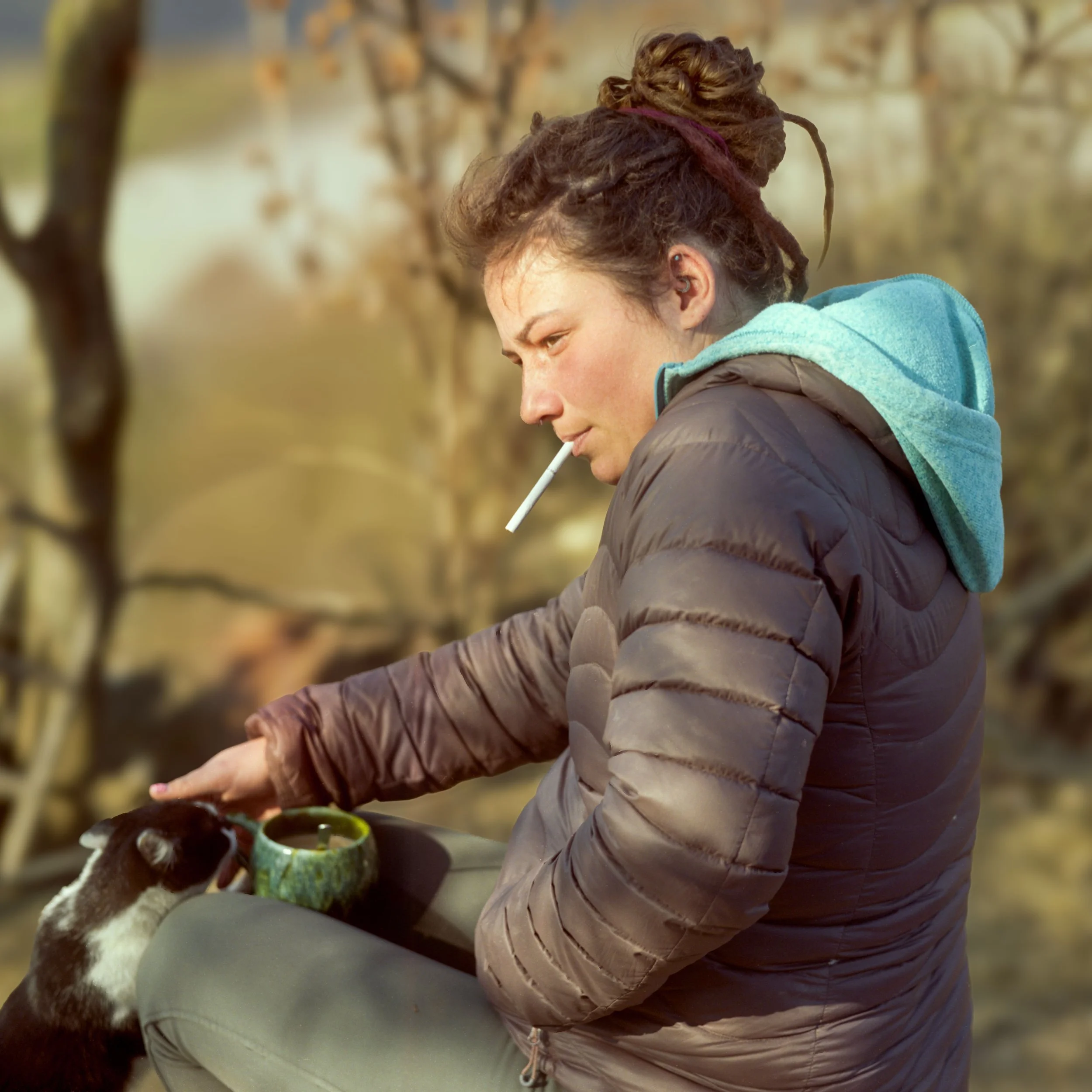 Woman smoking cigarette outdoors