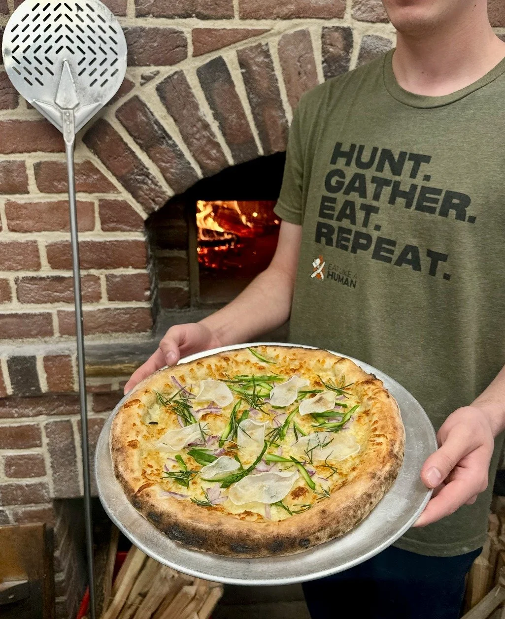 Simple and seasonal - April asparagus from Lockbriar Farm.

This week&rsquo;s pizza starts with our red base: wild, long-fermented sourdough, crushed San Marzano tomatoes, and pasta filata cheese.

Topped with house-made smoked Italian sausage, ferme